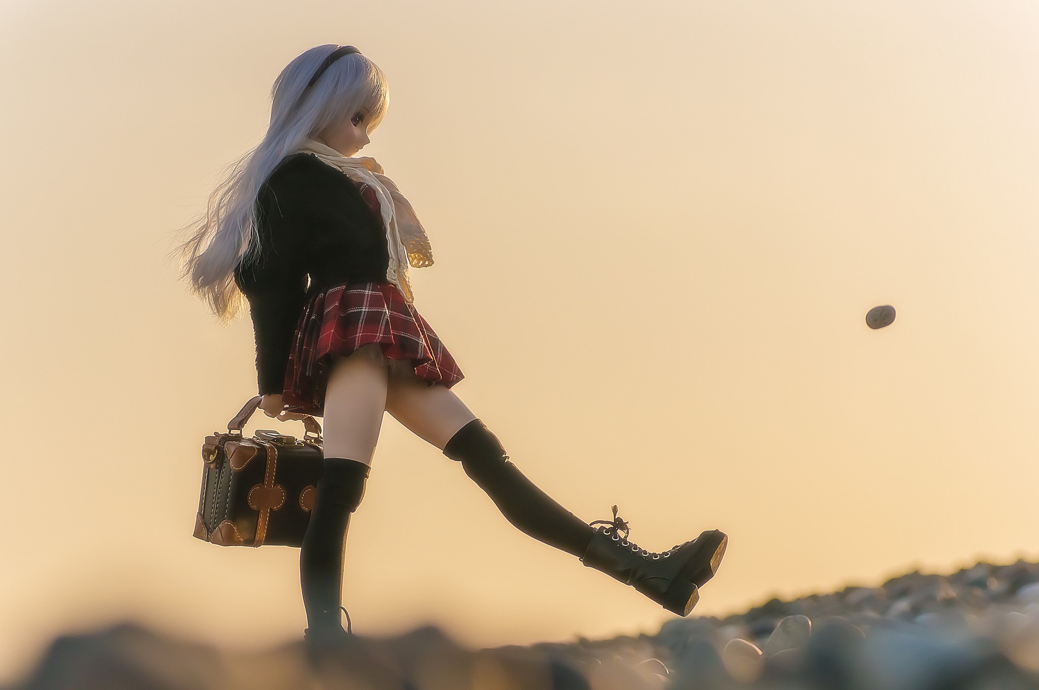 Doll in school uniform kicking a stone HD Wallpaper