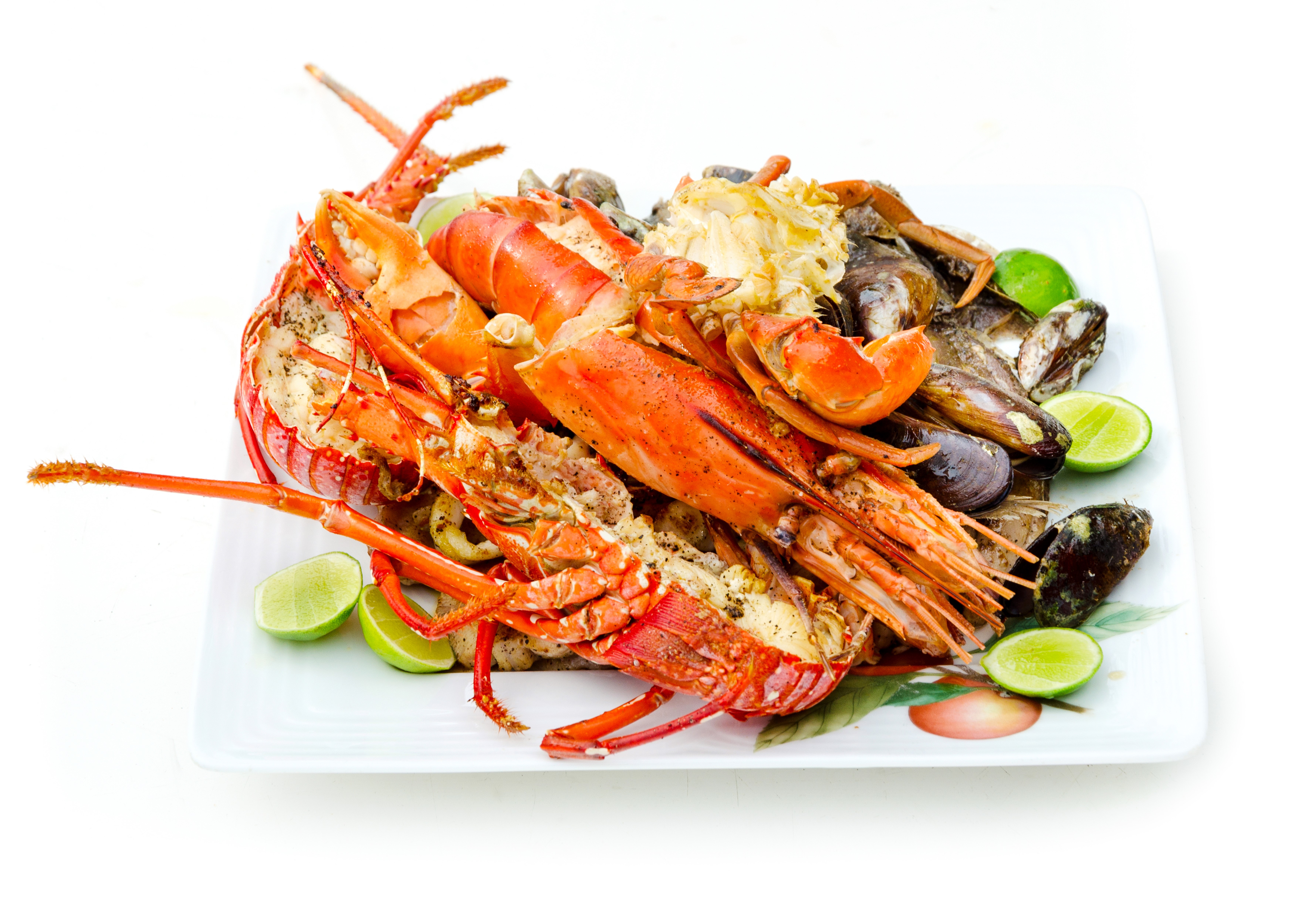 Seafood platter with lobster, mussels, clams, and lime HD Wallpaper