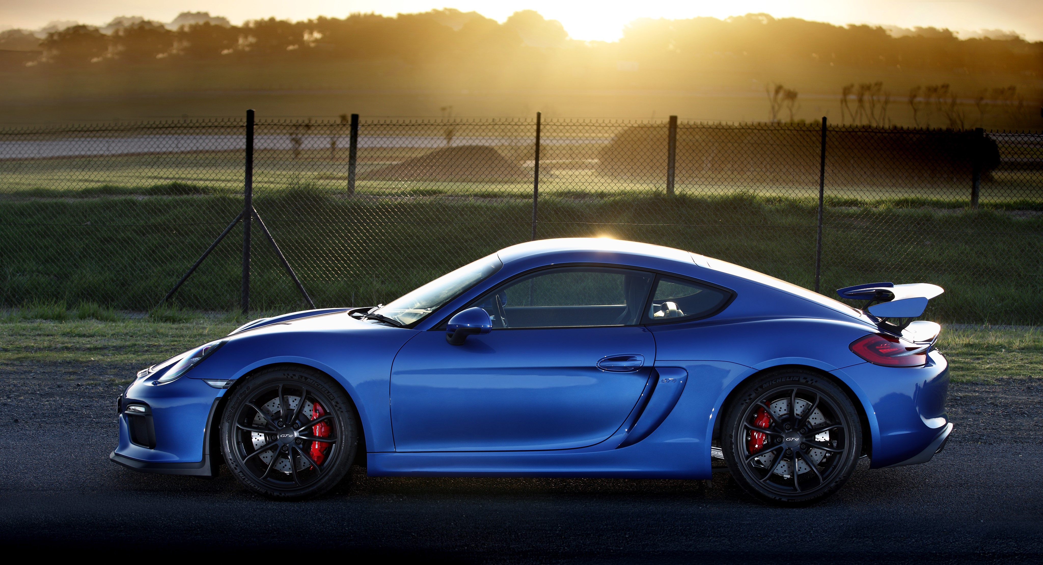 4K Porsche Cayman GT4 in Light Blue HD Wallpaper