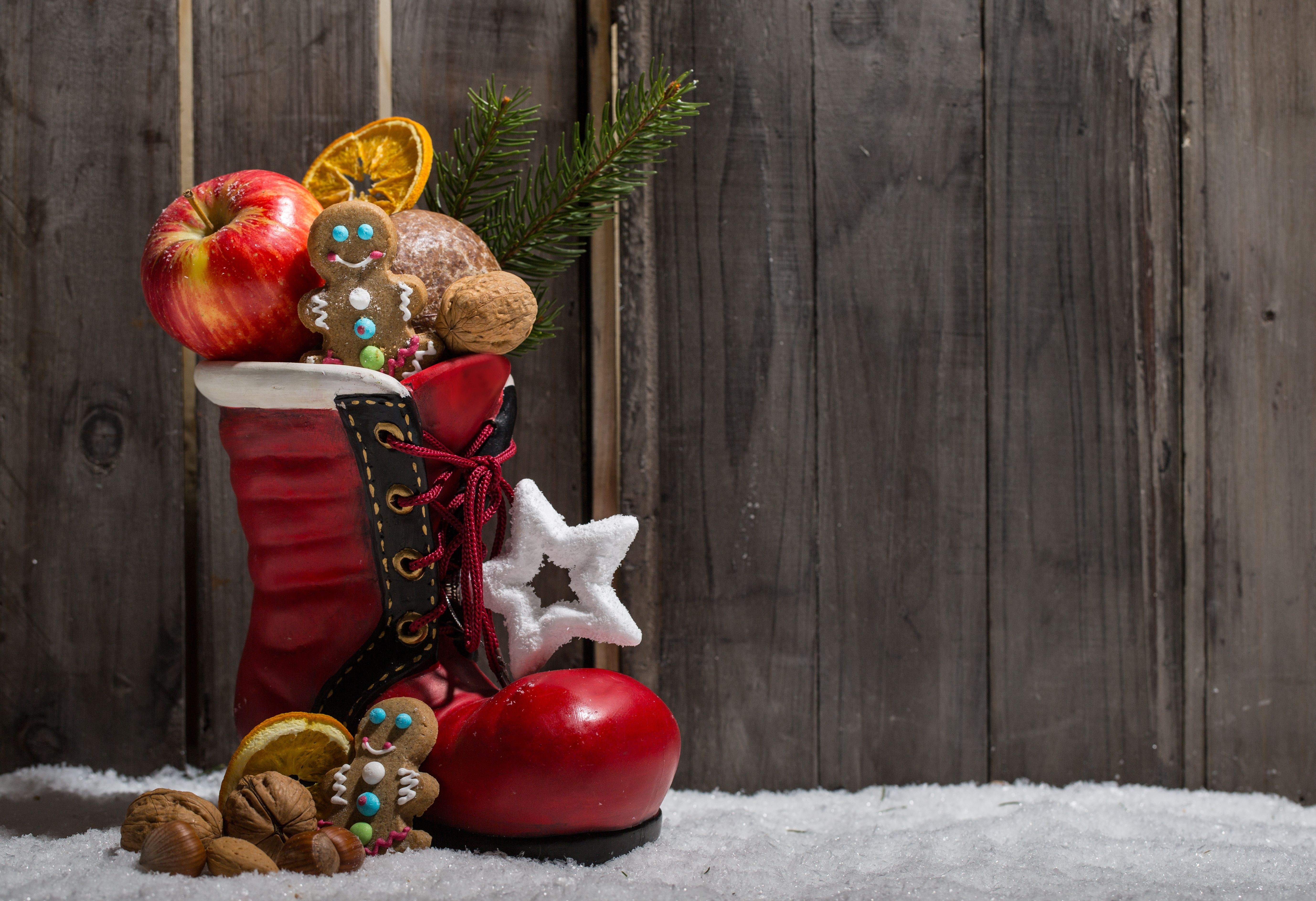 Christmas boot filled with treats and an apple HD Wallpaper