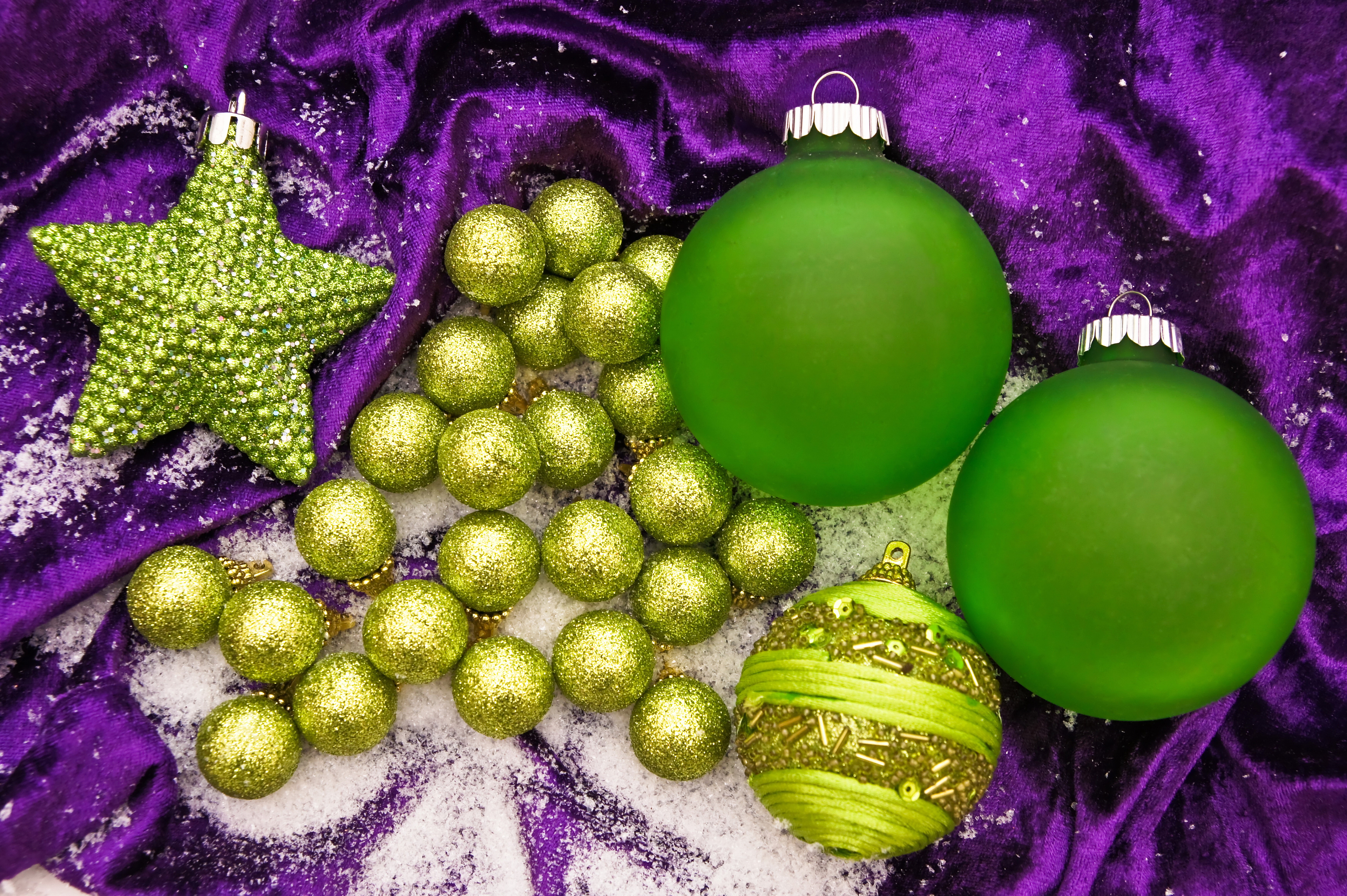 Christmas ornaments on purple velvet with snow HD Wallpaper