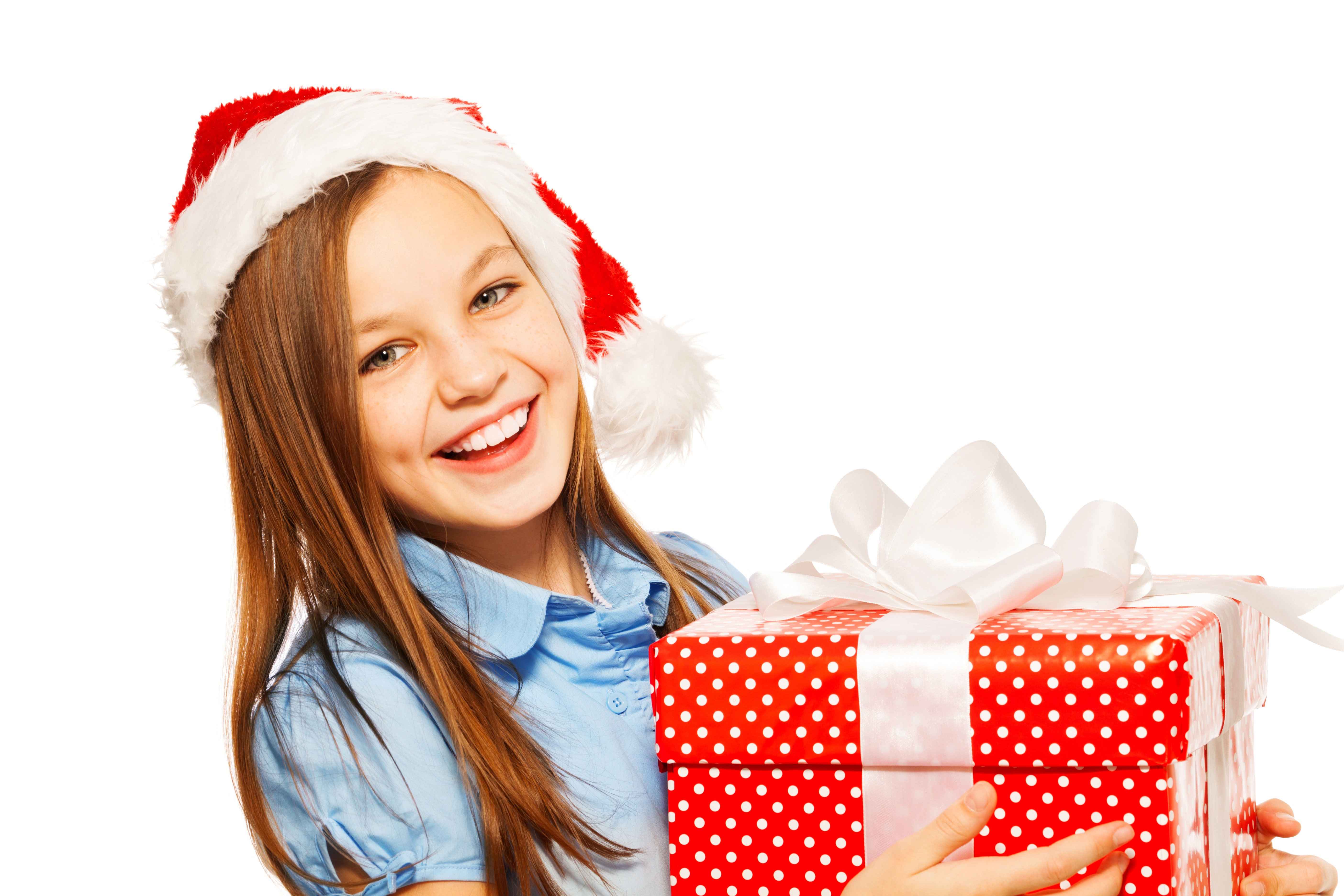 Smiling Girl in Santa Hat Holding Christmas Gift HD Wallpaper