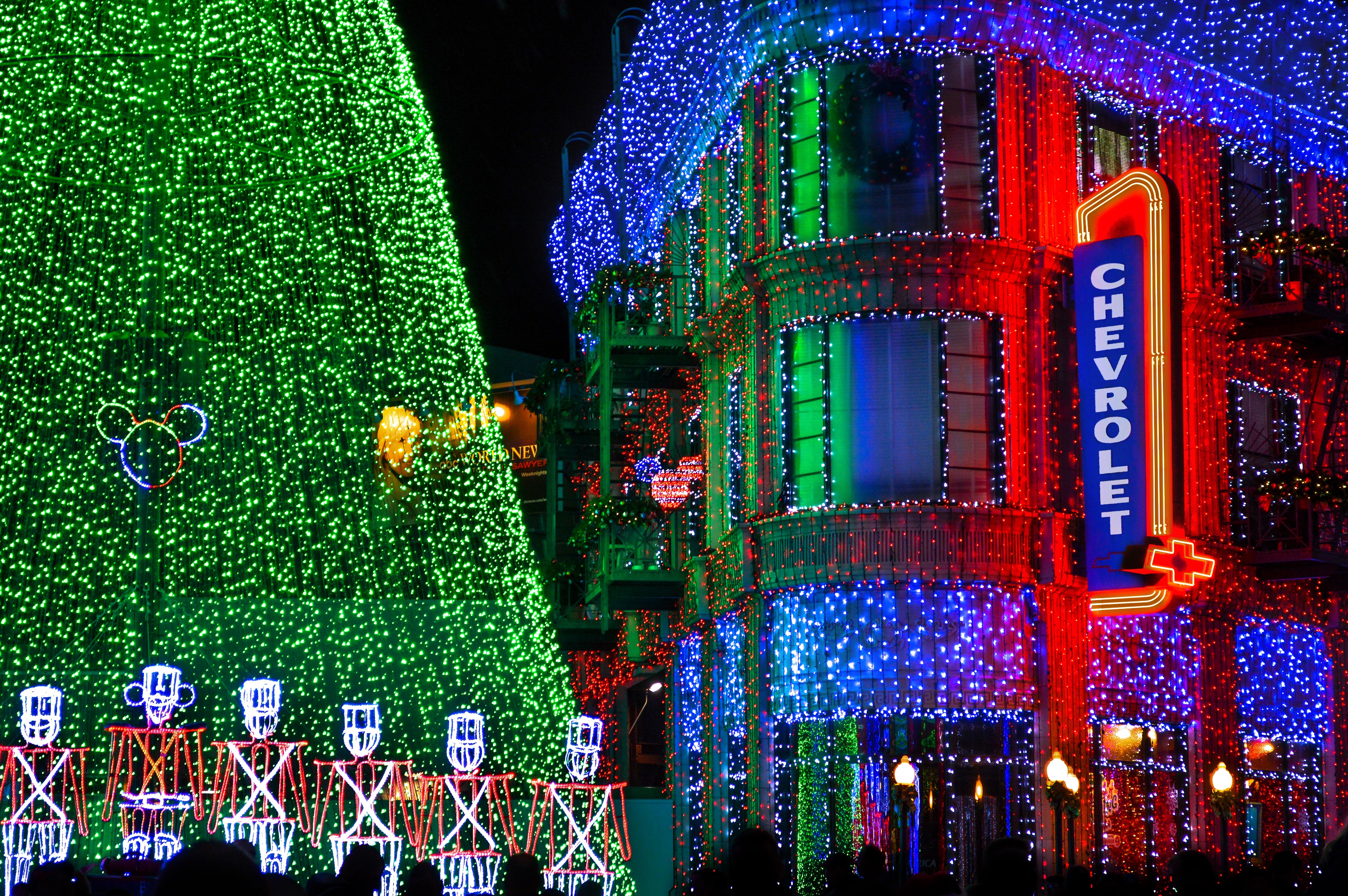 Disneyland Christmas Tree and Chevrolet Building with Lights HD Wallpaper