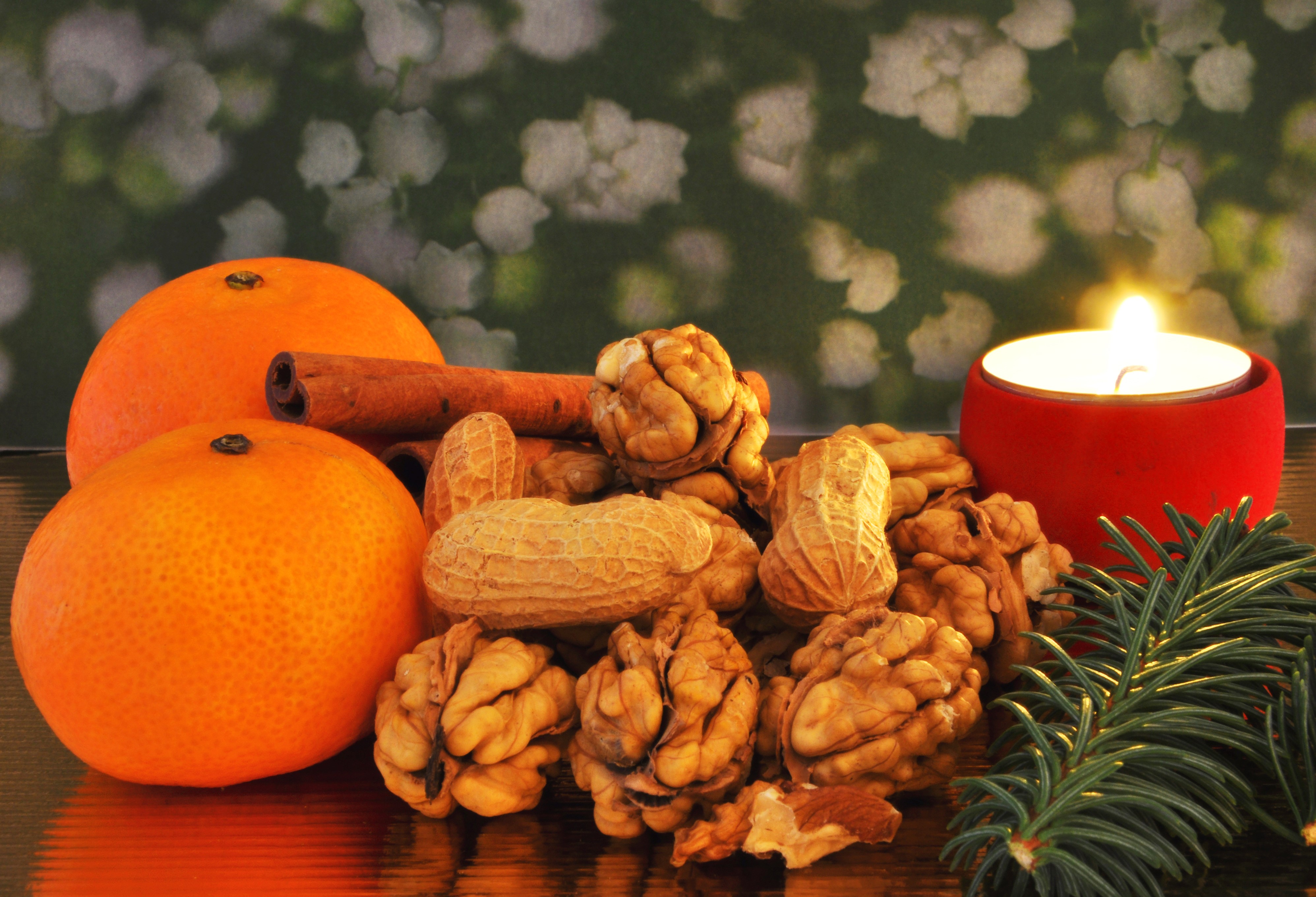Christmas still life with mandarins, nuts, cinnamon, and candle HD Wallpaper