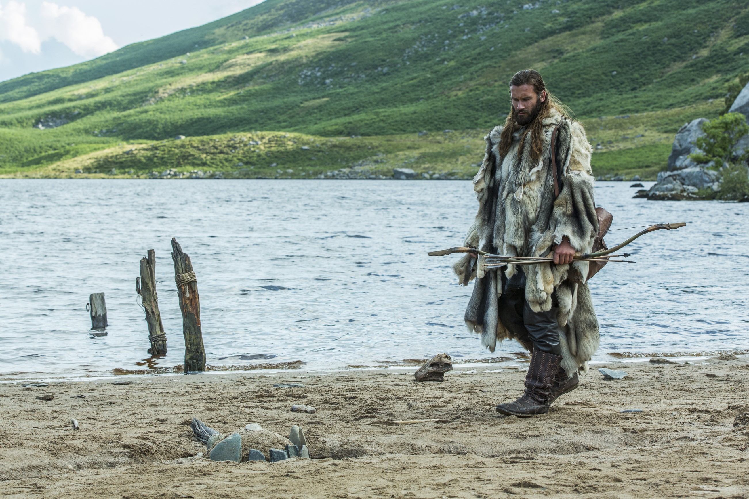 Rollo from Vikings with a bow on a beach HD Wallpaper