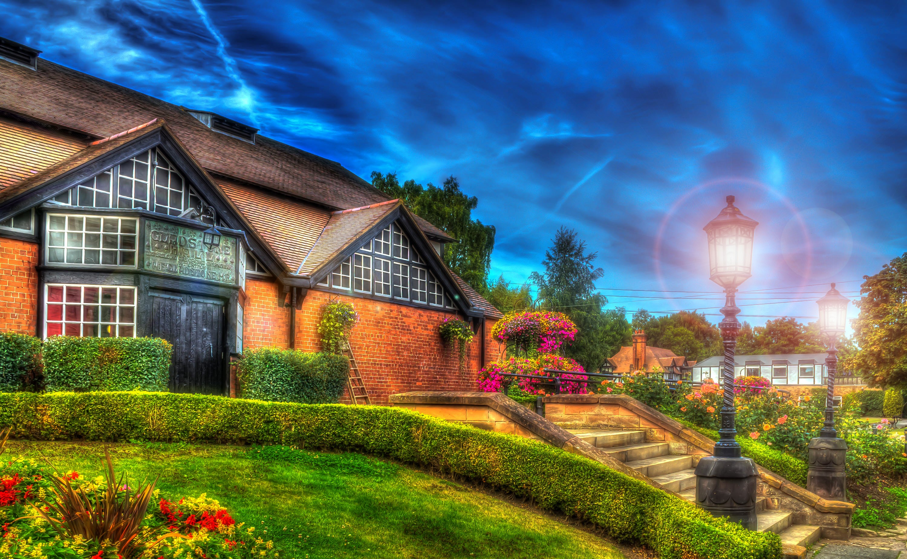 Brick building with stairs and street lights in Bebington, England HD Wallpaper
