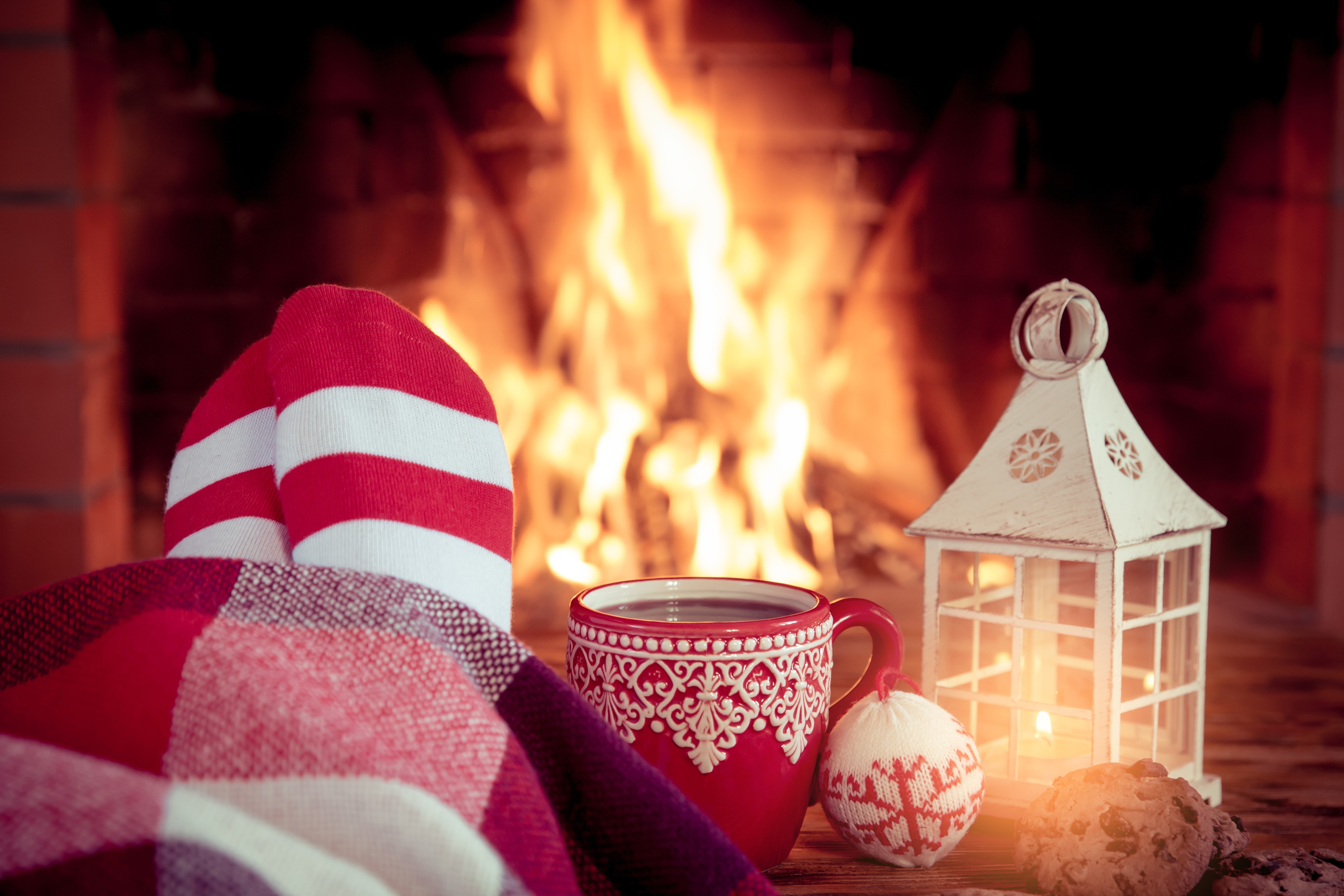Cozy Christmas scene with feet by the fireplace HD Wallpaper