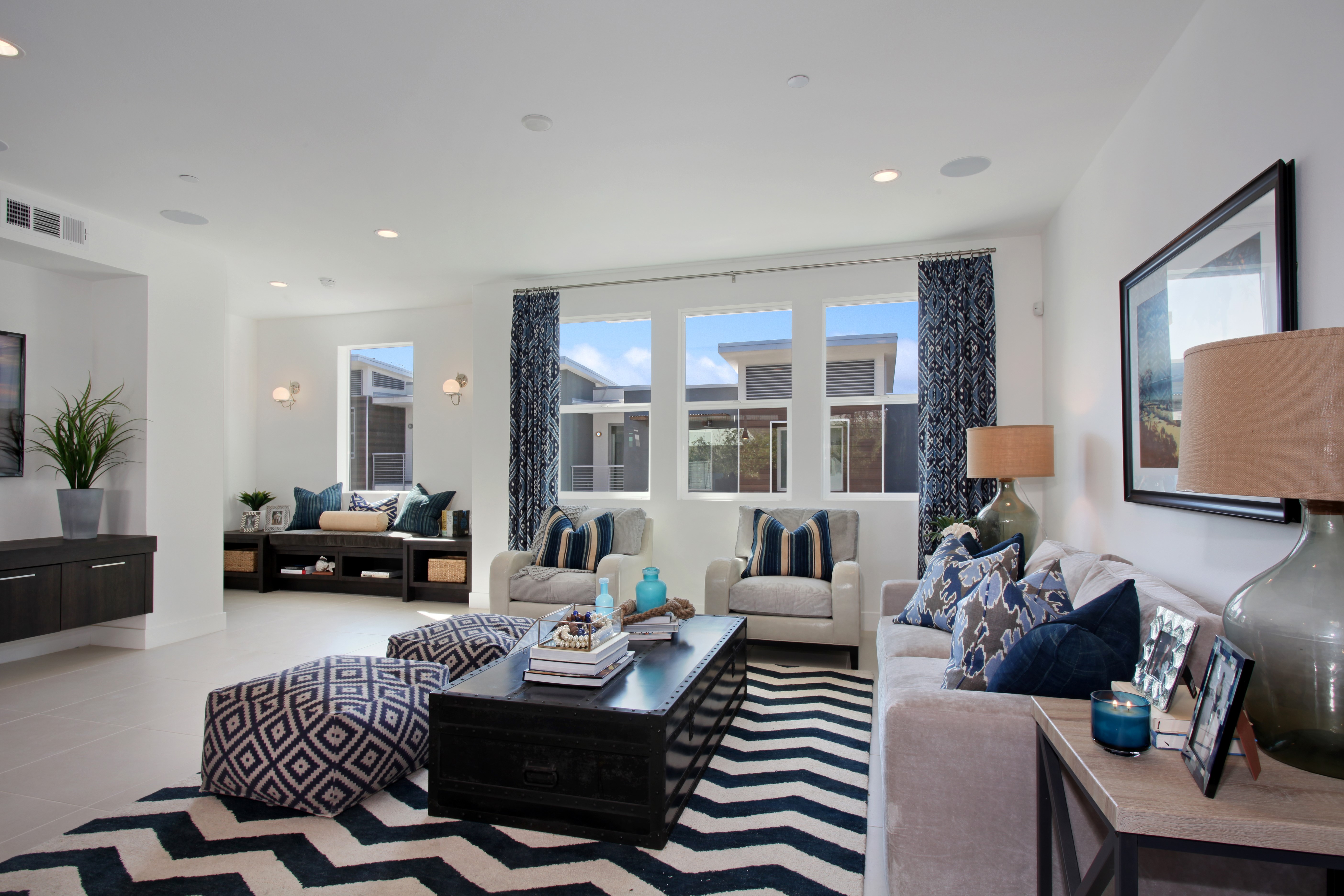 Living room with patterned rug and armchairs HD Wallpaper