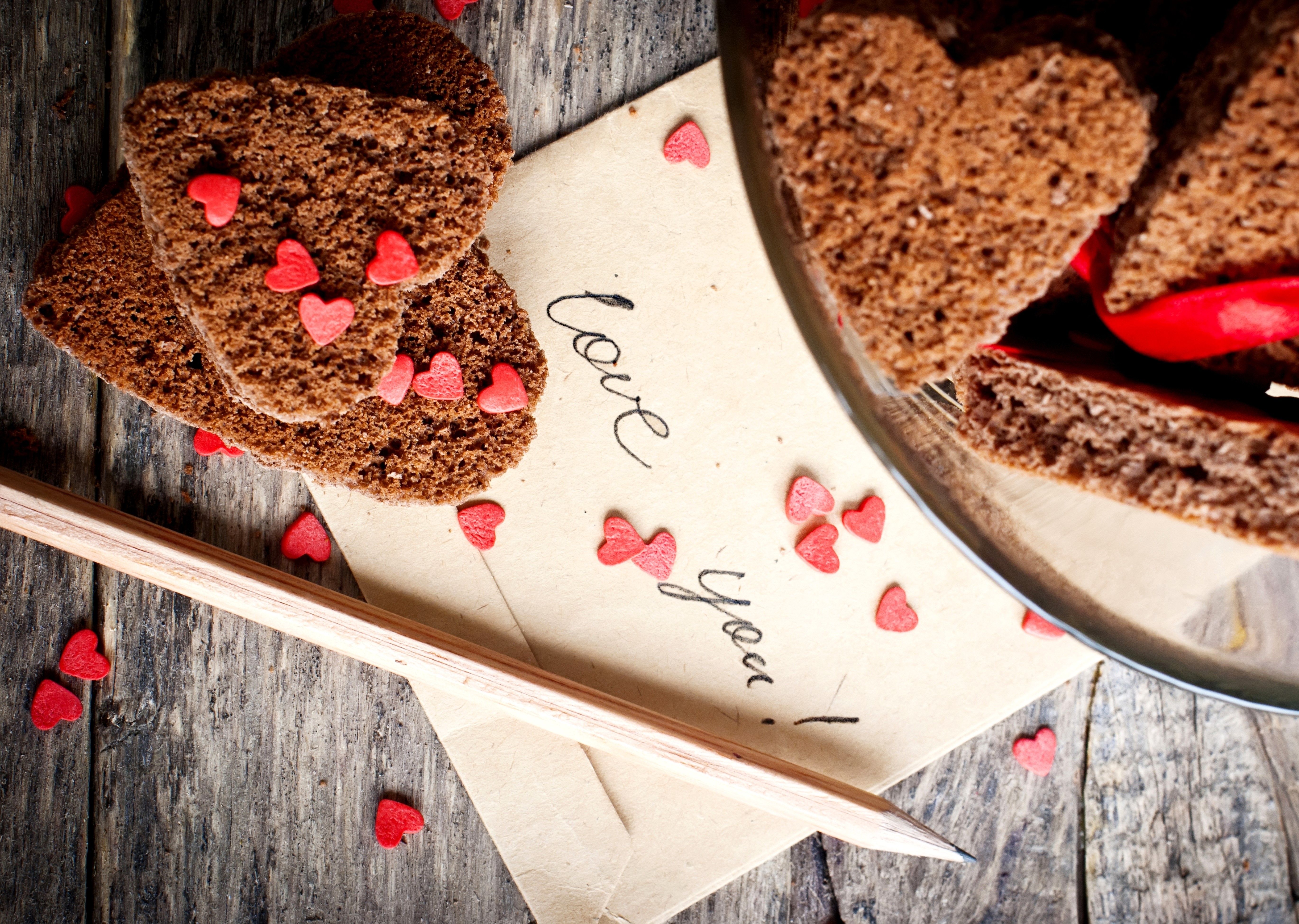 Heart-shaped cookies on a letter with a pencil HD Wallpaper