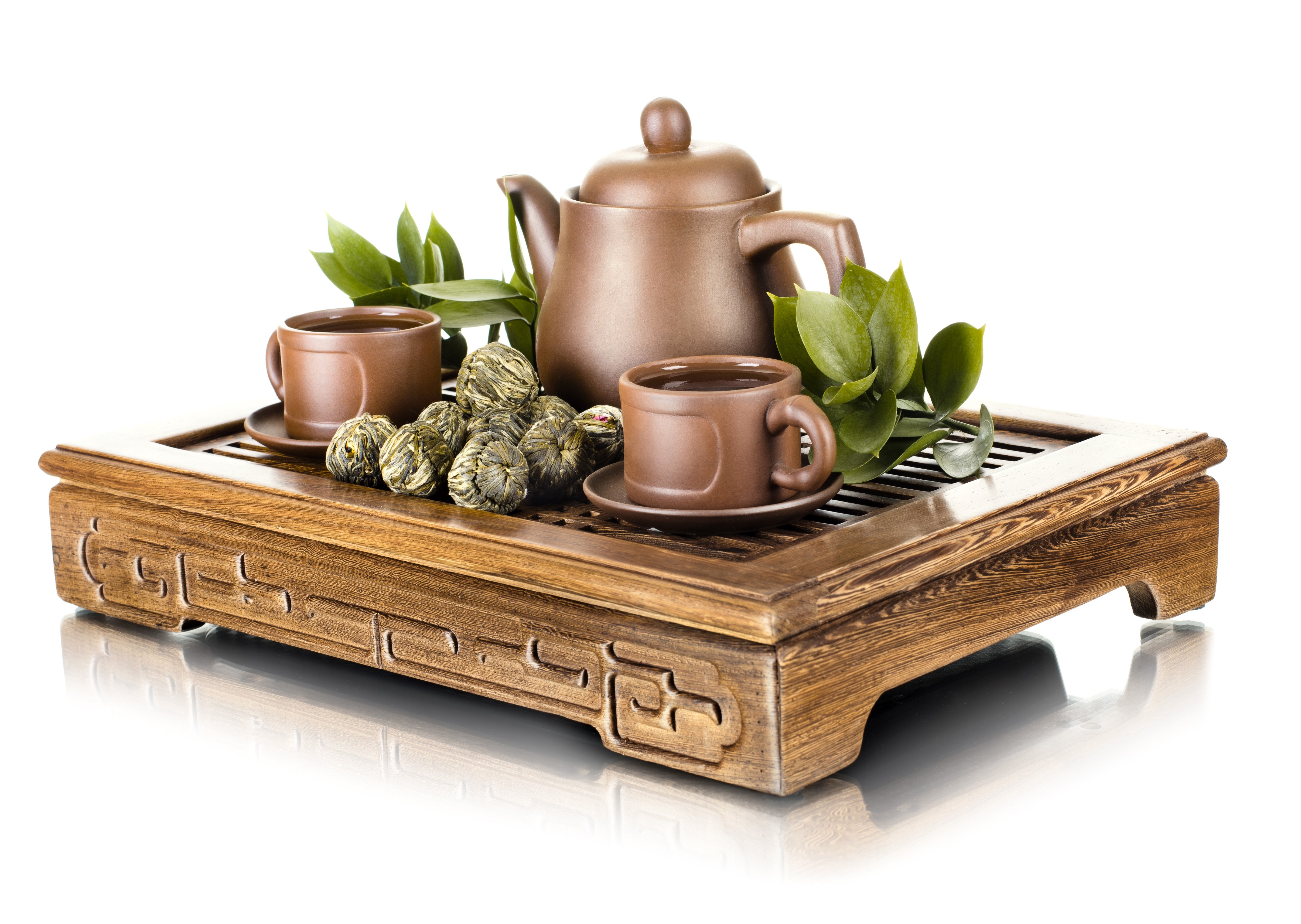 Tea set with cups, teapot, and tea balls on a wooden tray HD Wallpaper