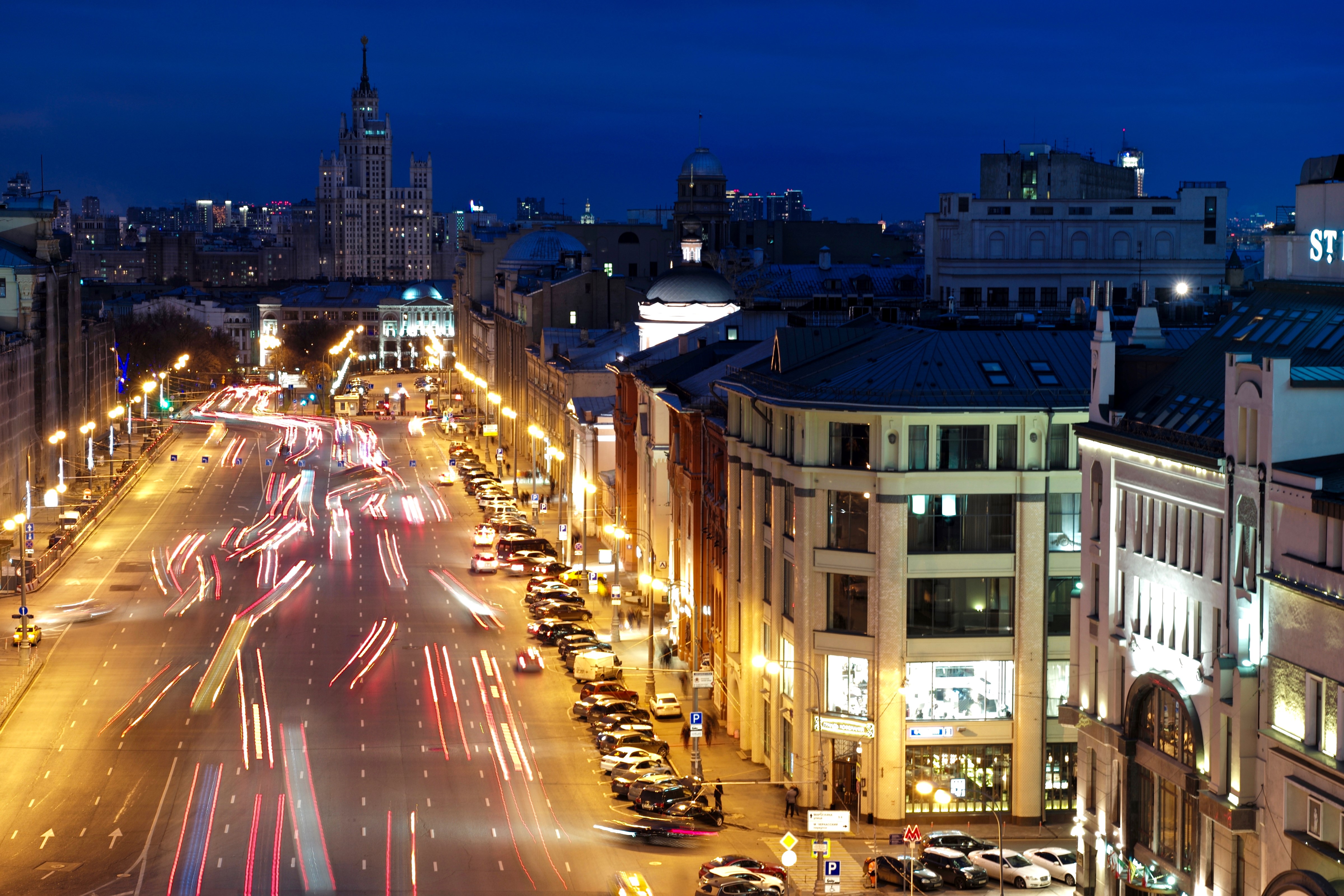 Moscow street at night with light trails from cars HD Wallpaper