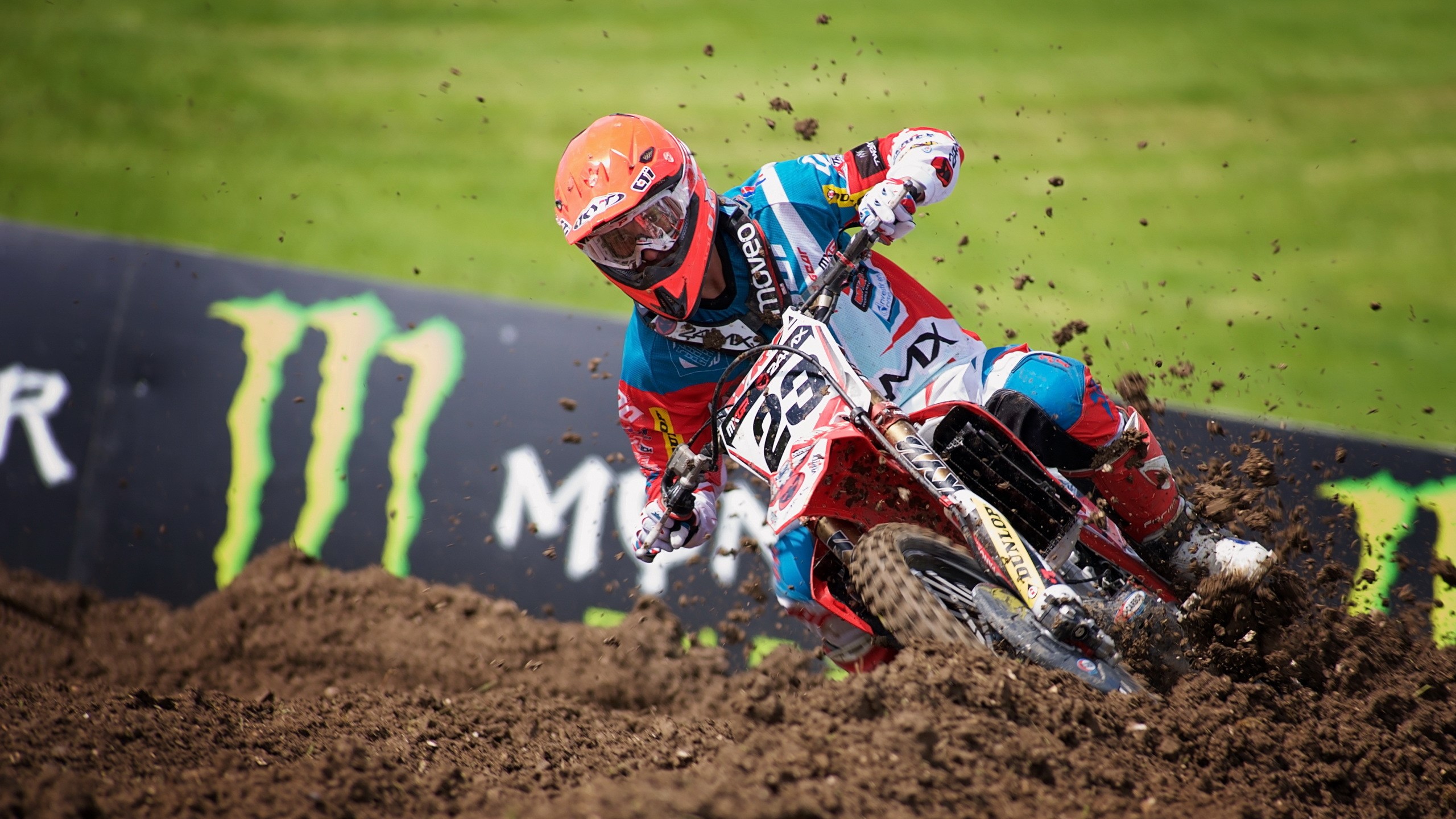 Motocross rider in action with Monster Energy banner HD Wallpaper