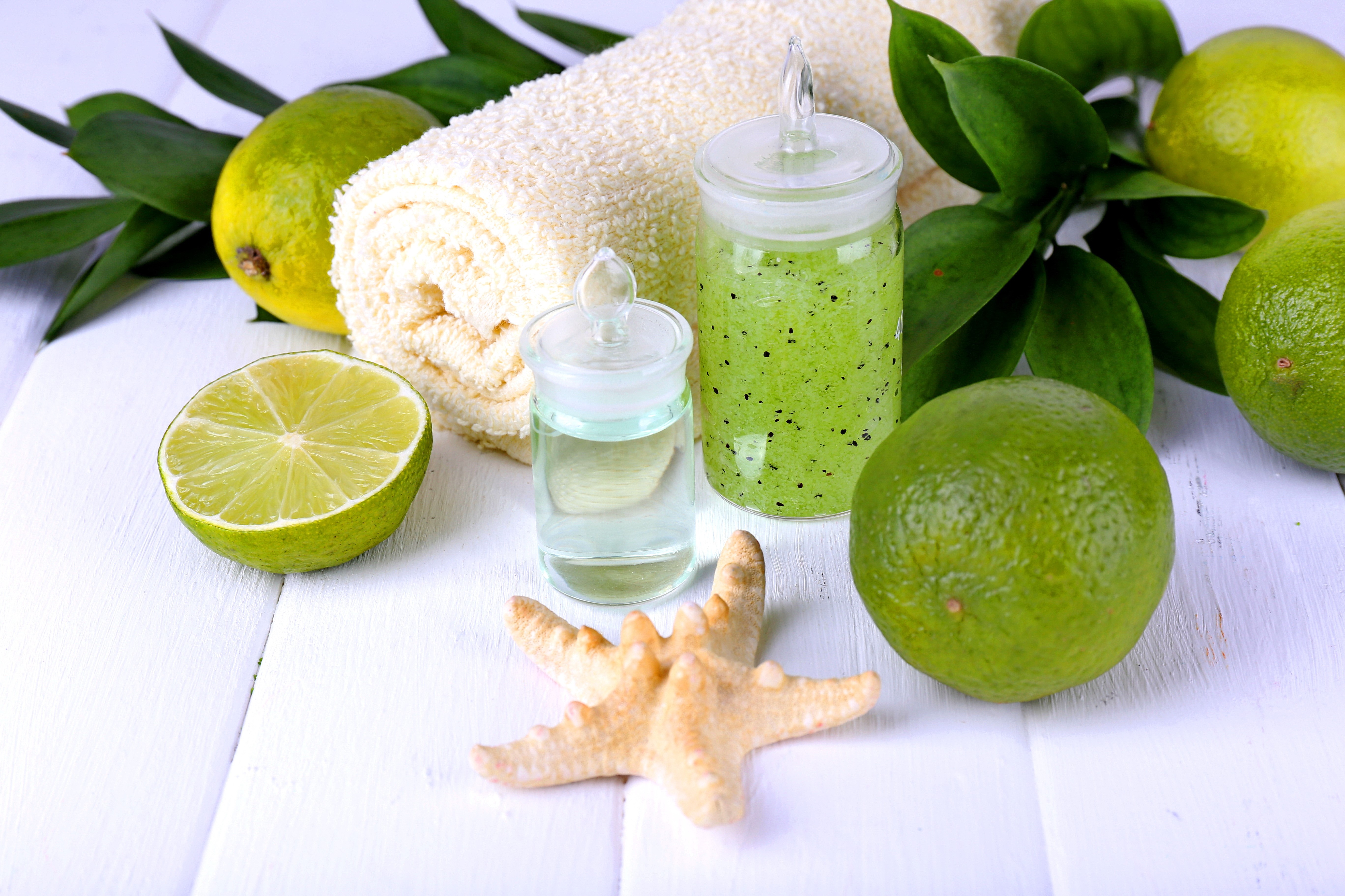 Spa products with limes and towel HD Wallpaper