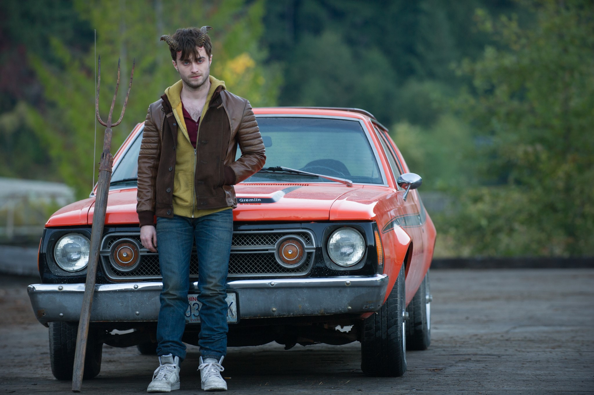 Daniel Radcliffe as a demon with a pitchfork and a car HD Wallpaper