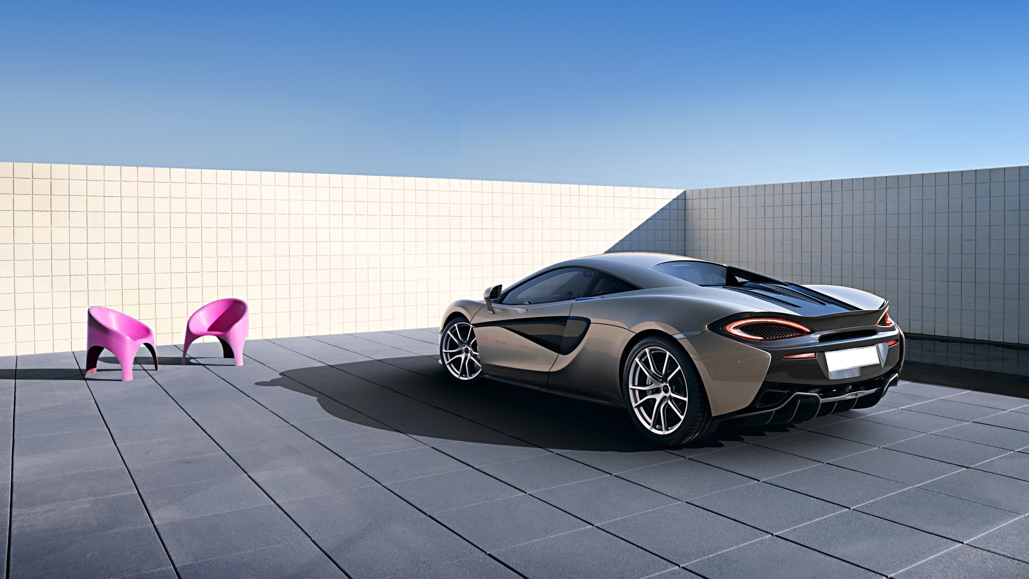 McLaren 570S Coupe parked on tiled patio HD Wallpaper
