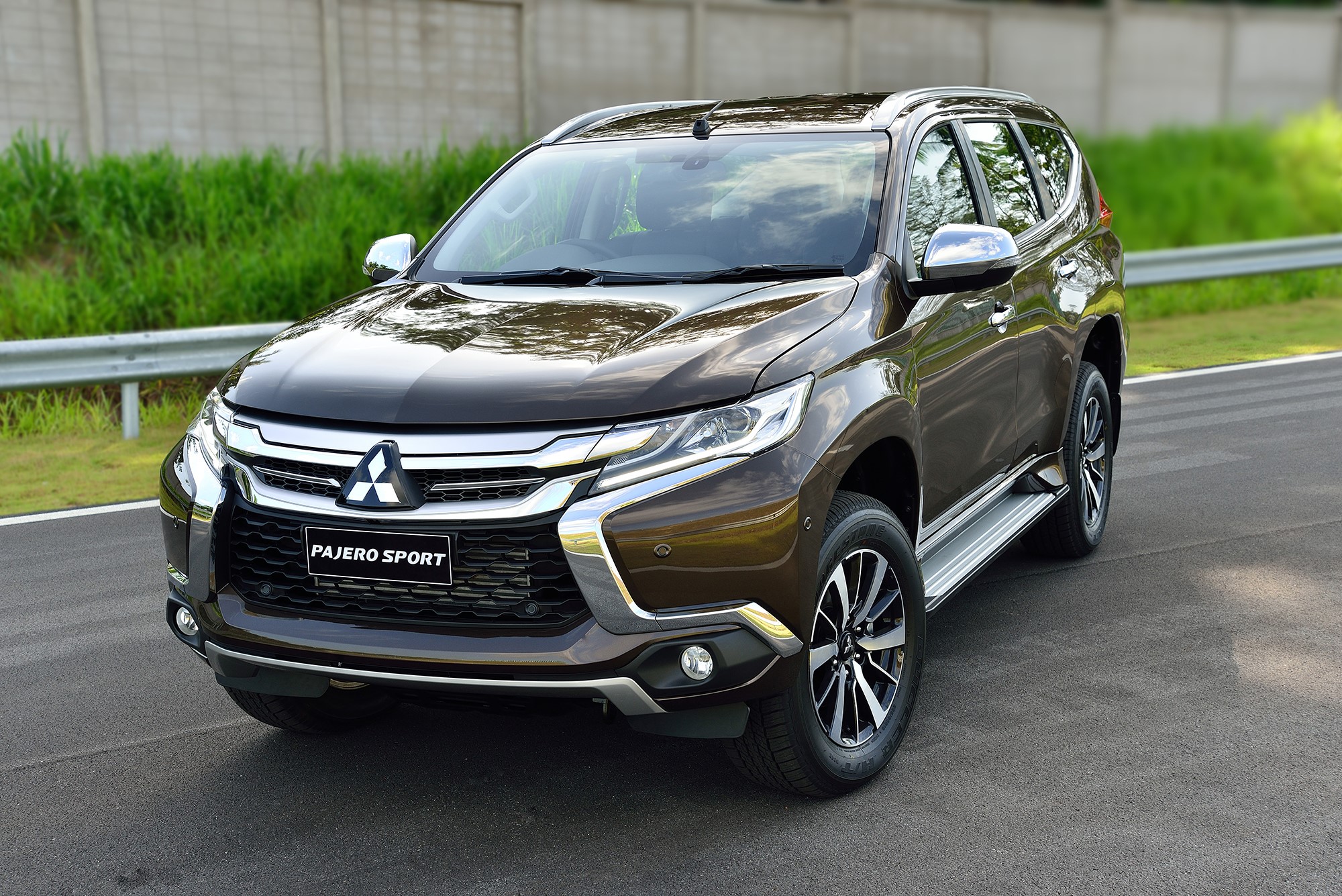 Brown Mitsubishi Pajero Sport SUV on a road HD Wallpaper