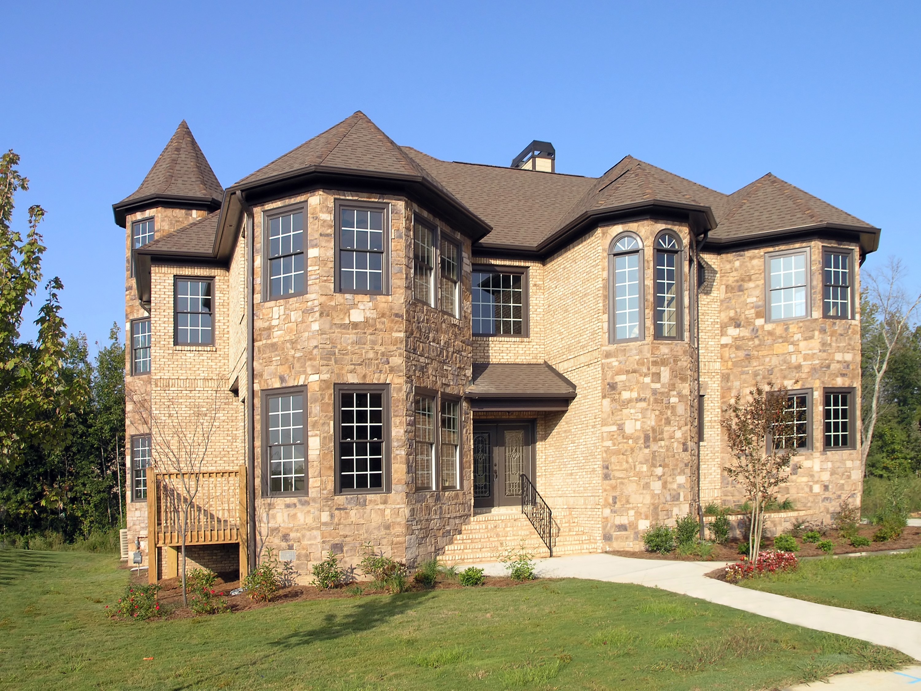 Large stone and brick house with turrets HD Wallpaper