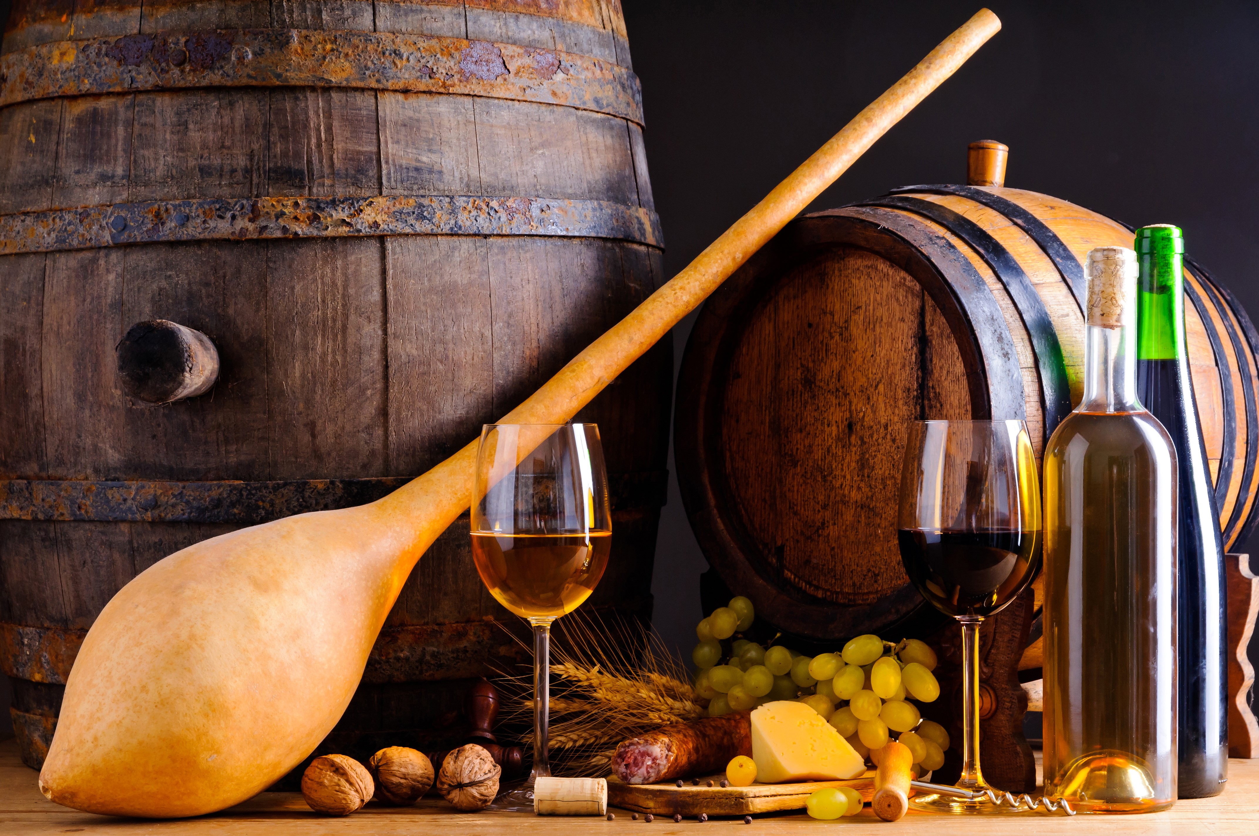 Wine barrels with wine, cheese, sausage, and nuts HD Wallpaper