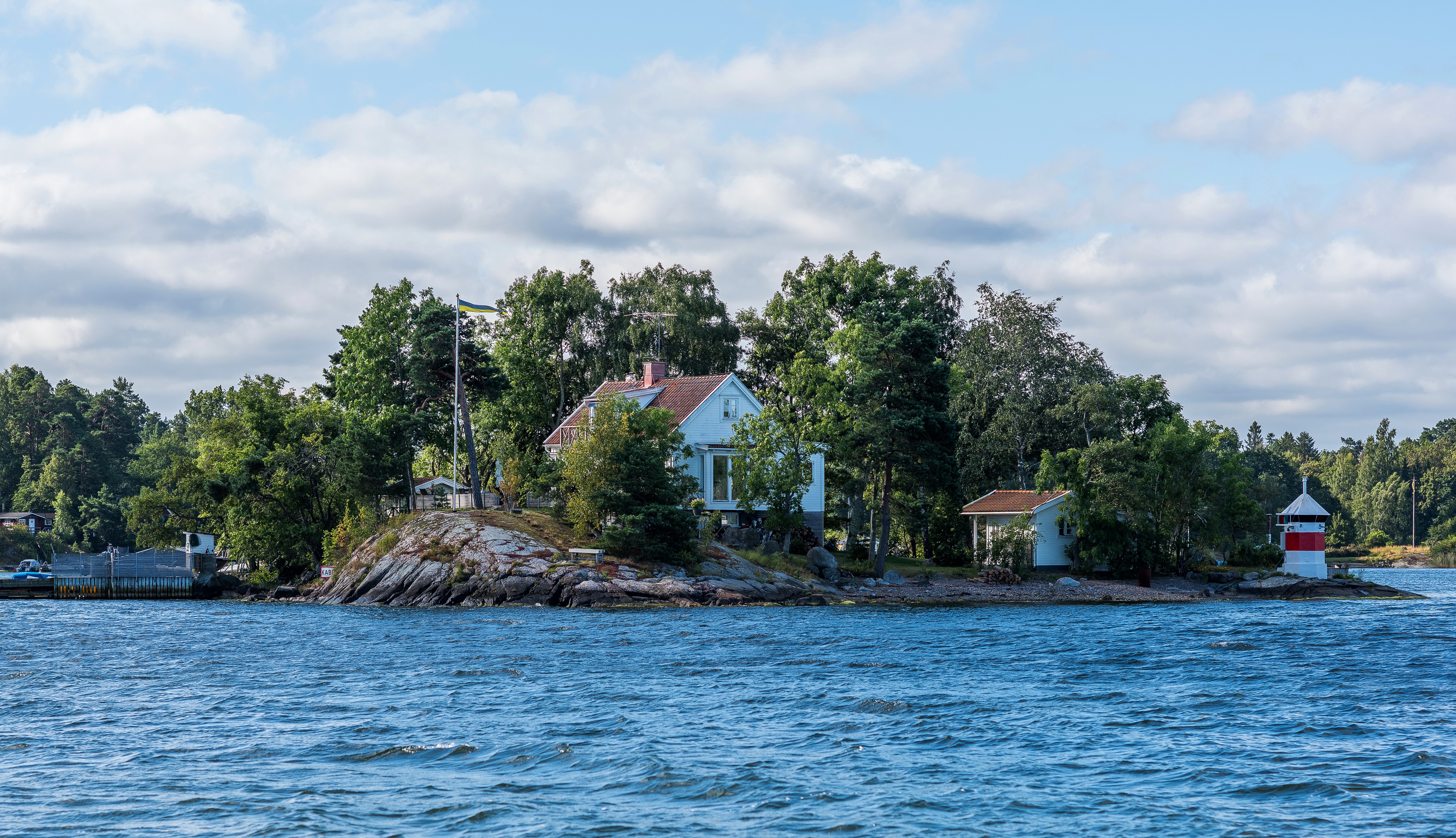 Island houses and lighthouse in Sweden HD Wallpaper