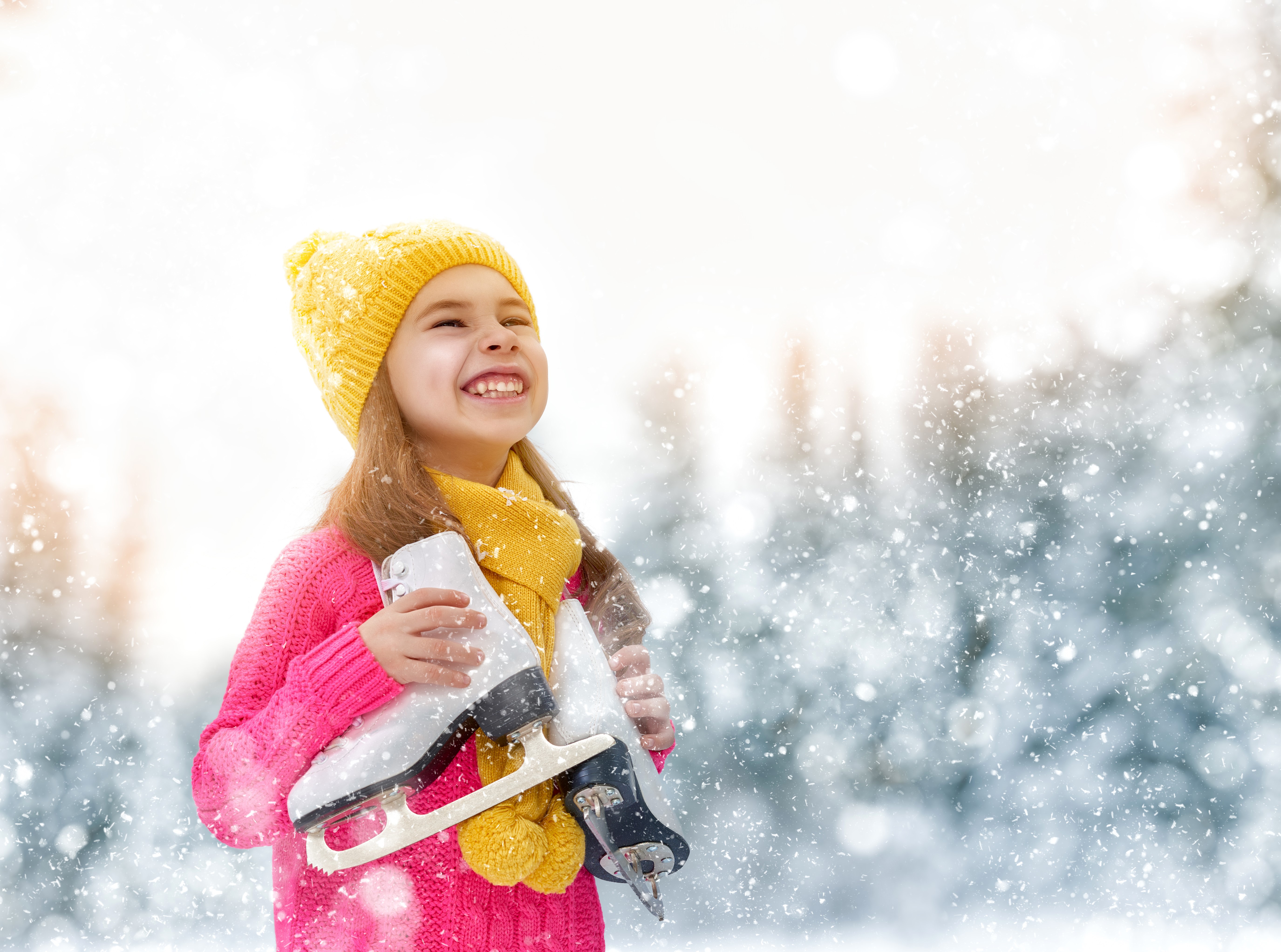 Girl in Winter Hat Holding Ice Skates HD Wallpaper