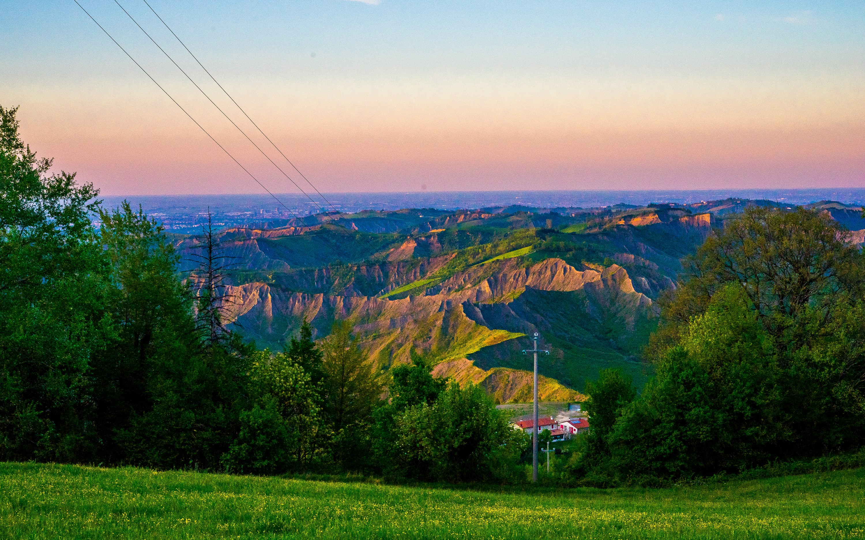 Rolling hills and valleys at sunset near Brisighella, Italy HD Wallpaper