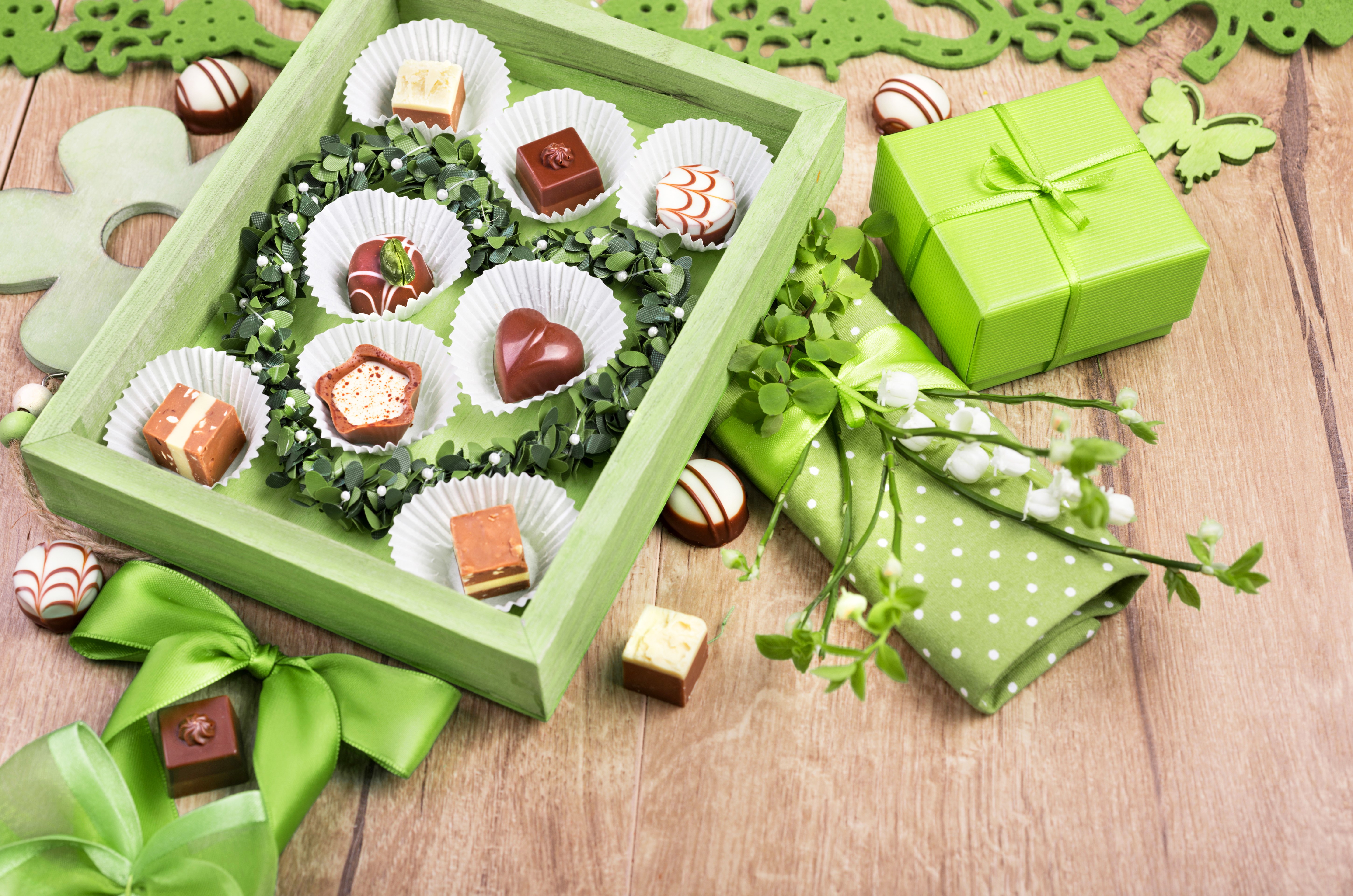 Chocolates in a box with gift and flowers HD Wallpaper