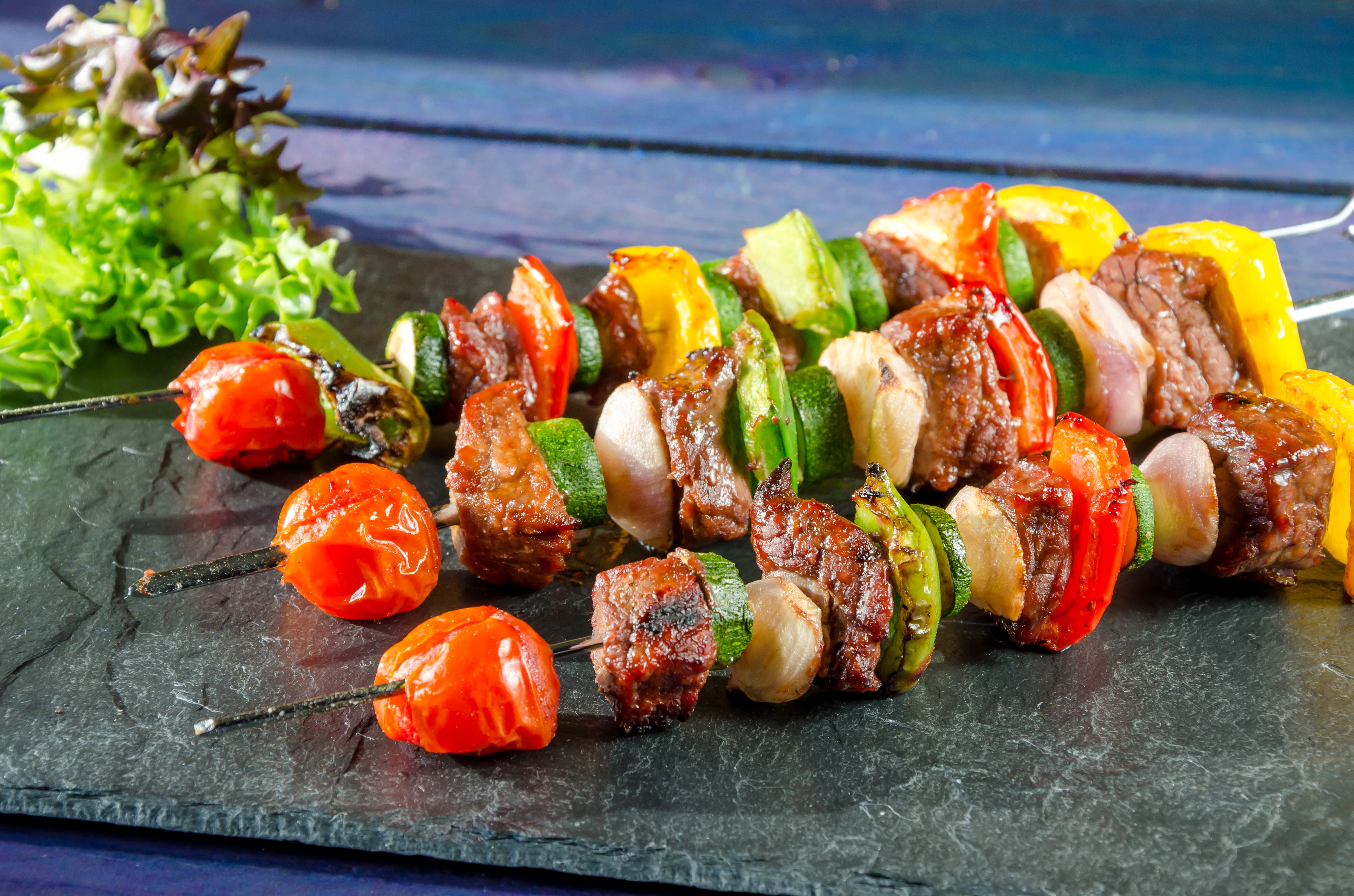 Meat and Vegetable Skewers on a Slate Plate HD Wallpaper