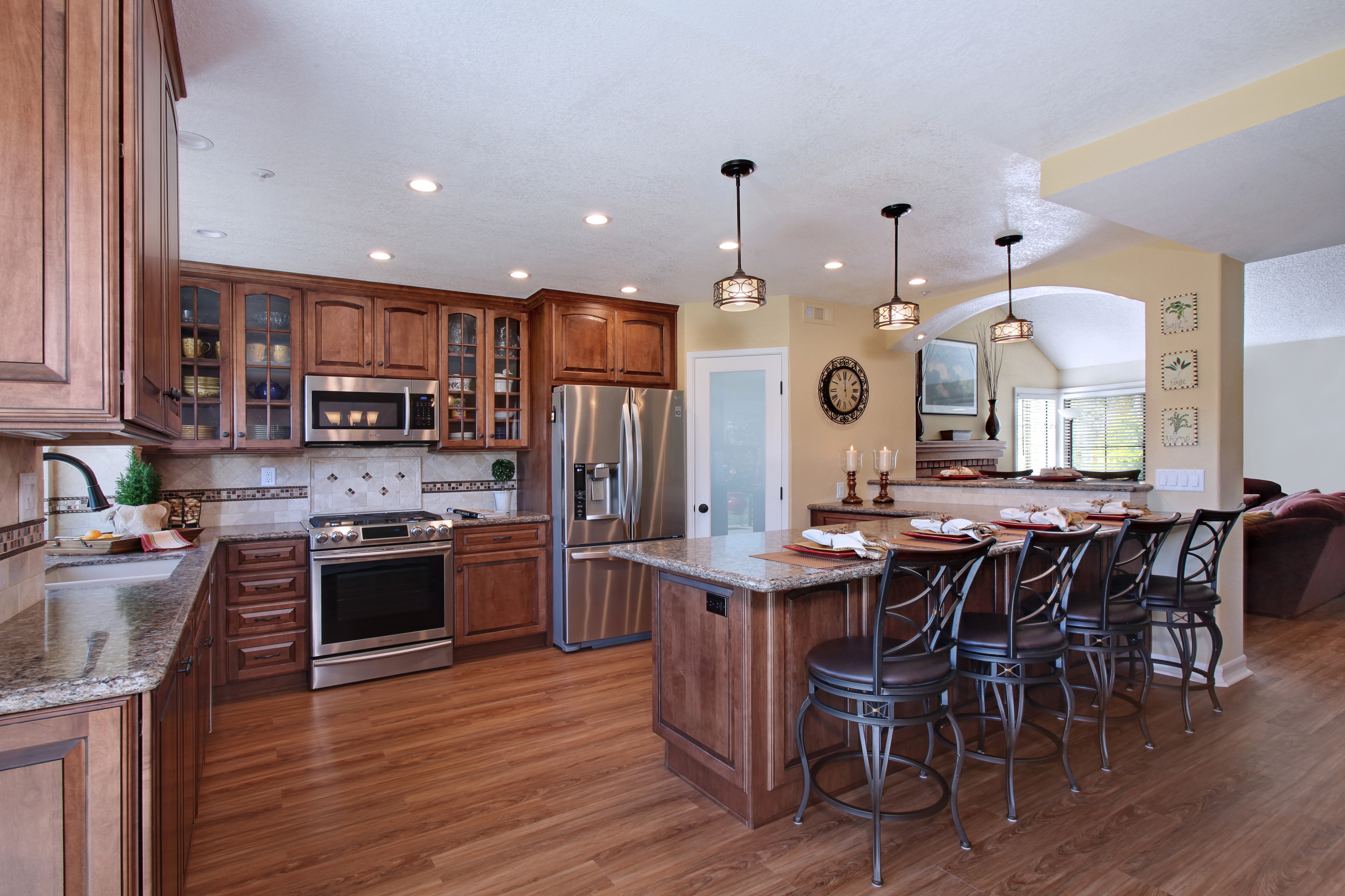 Kitchen with Island, Stools, and Dining Area HD Wallpaper