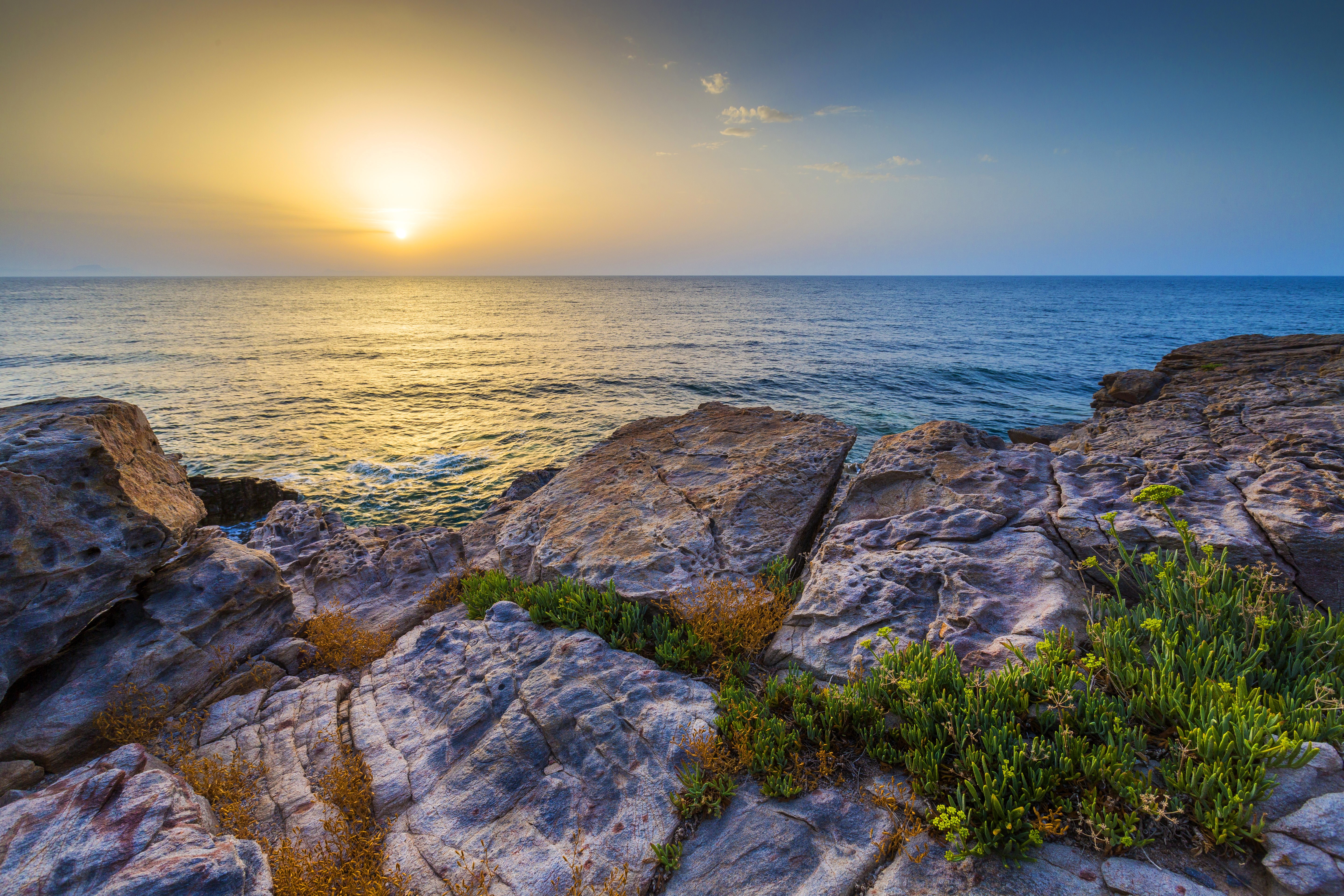 Sunset over the rocky coast HD Wallpaper