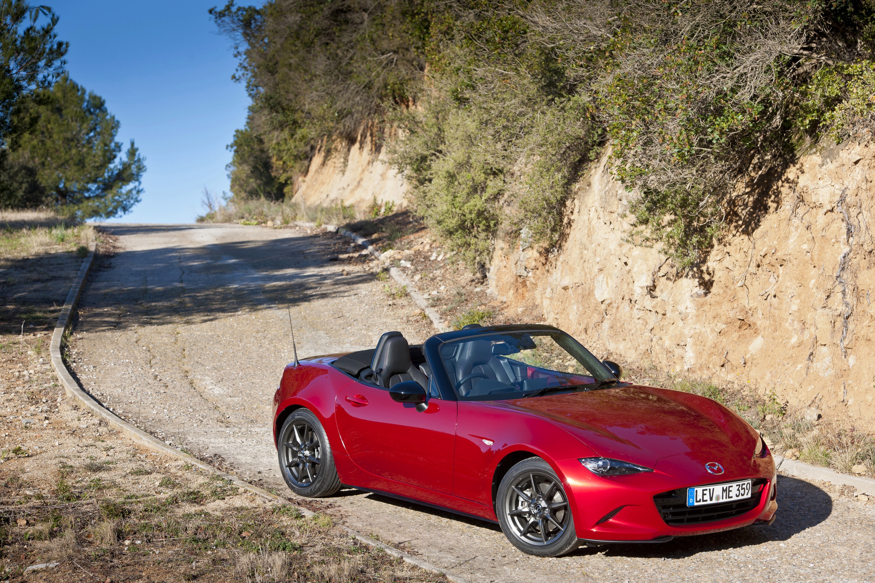 Red Mazda MX-5 Convertible on a Winding Road HD Wallpaper