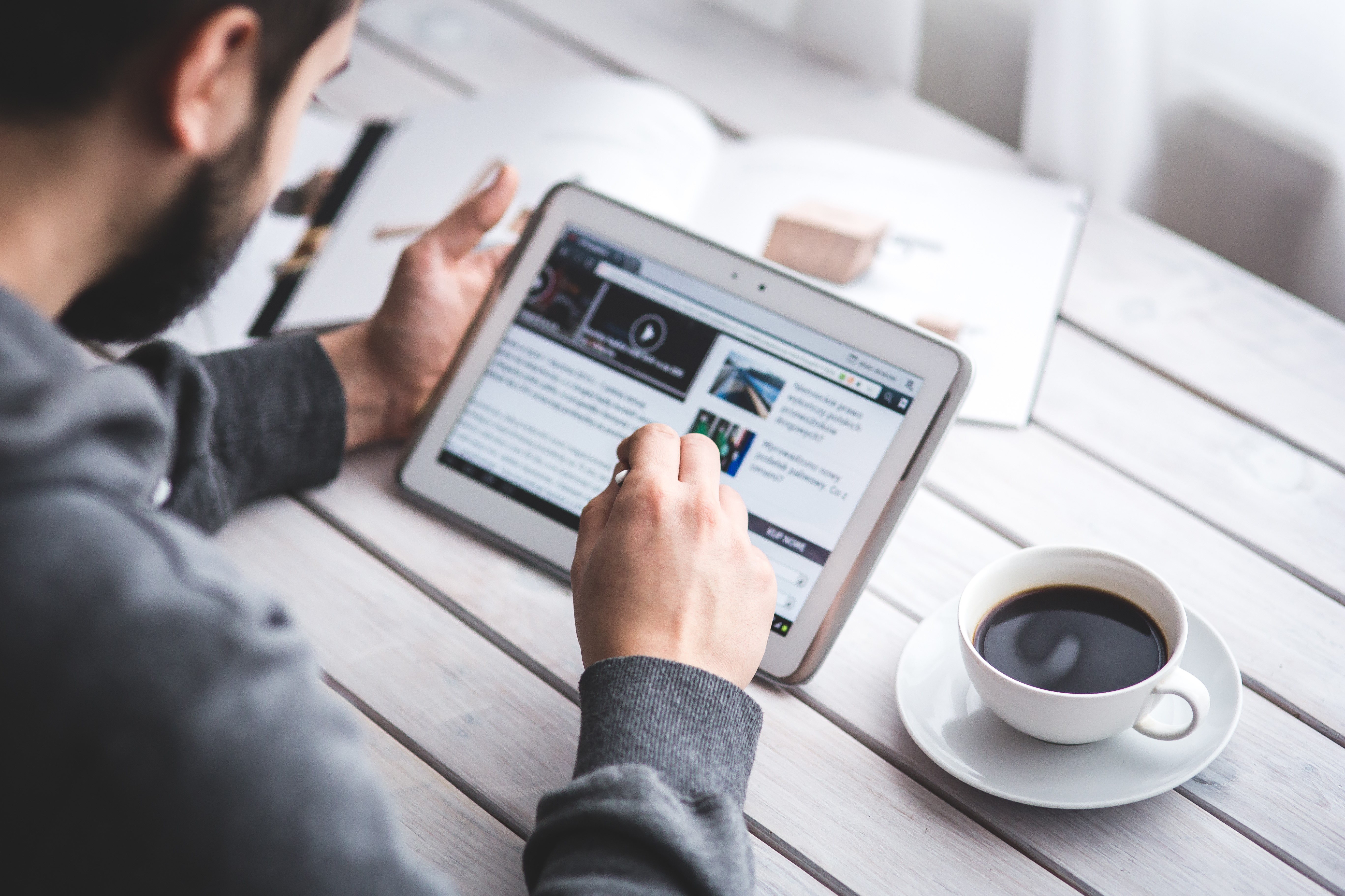 Man reading on tablet with coffee HD Wallpaper