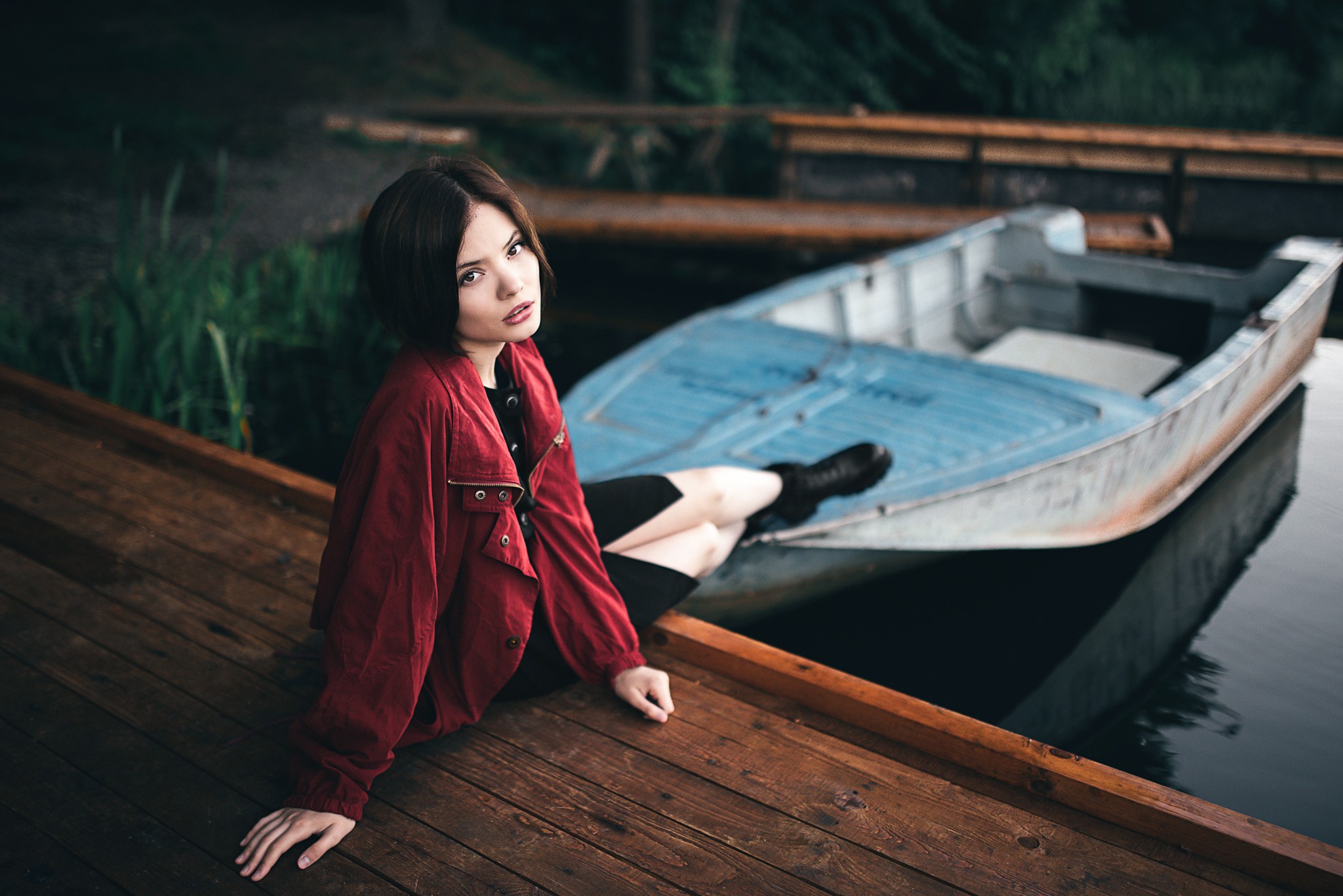 Woman in red jacket by a boat HD Wallpaper