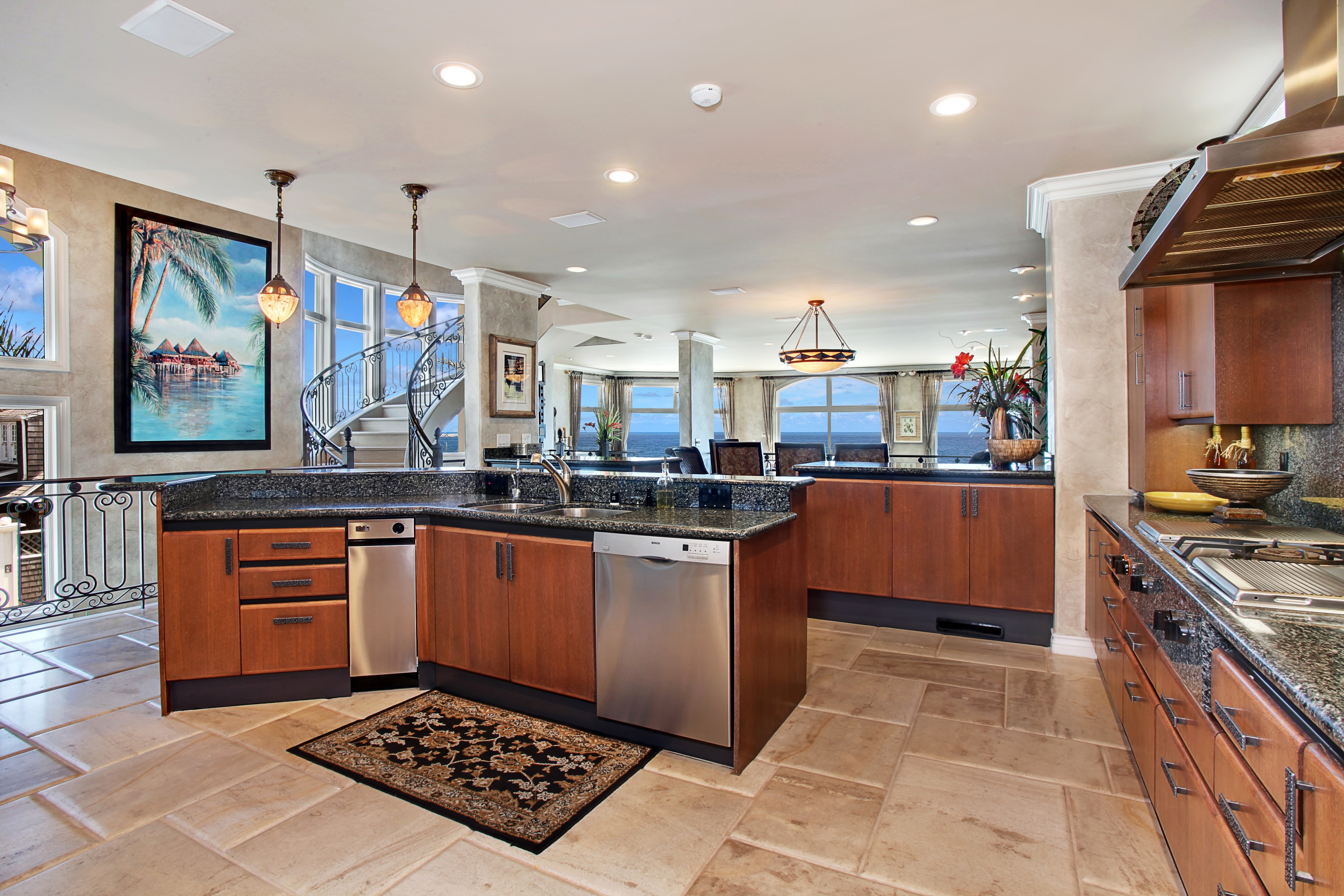 Luxury Kitchen with Ocean View and Spiral Staircase HD Wallpaper
