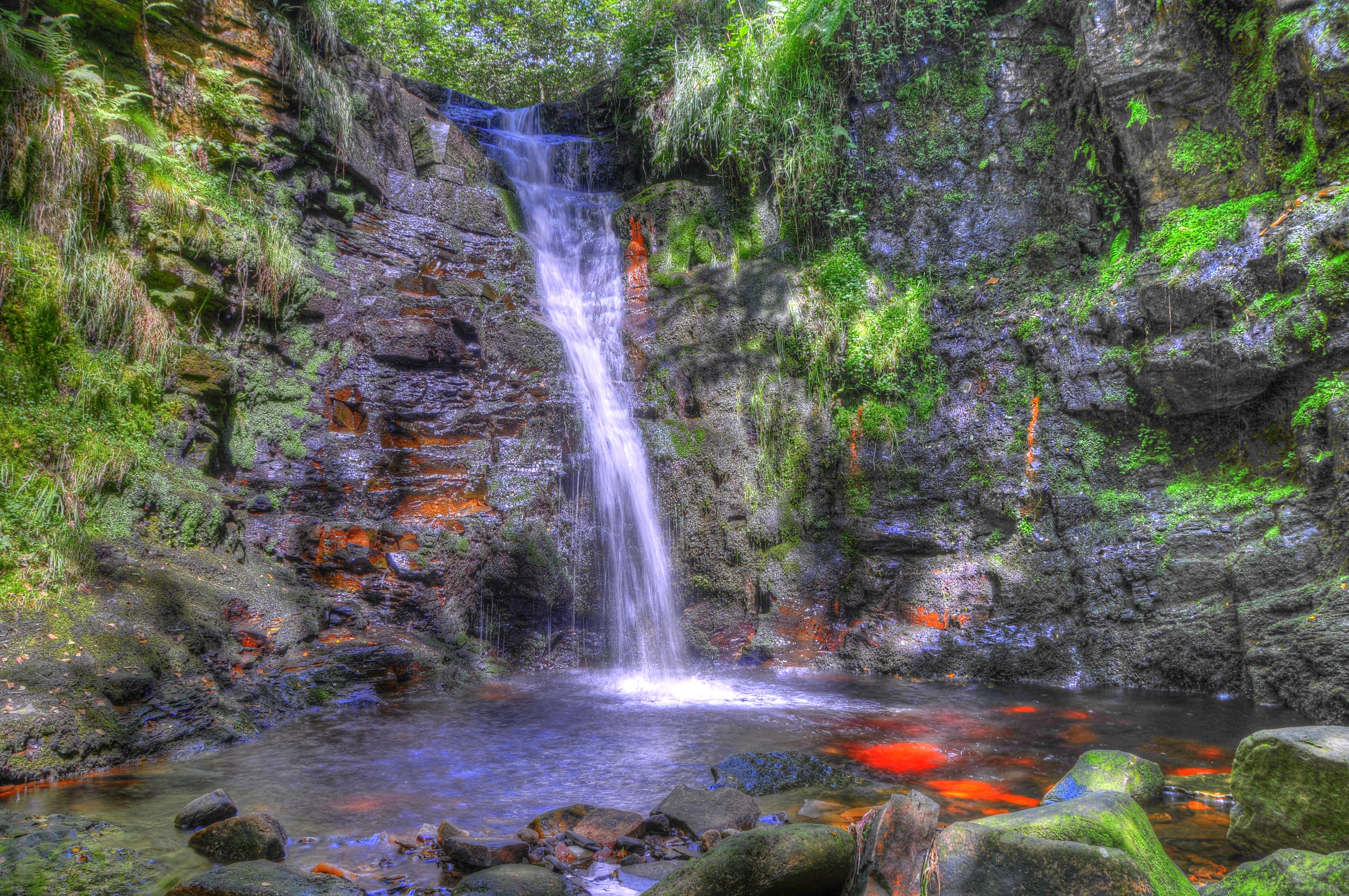 Waterfall cascading over mossy rocks in Anglezarke, England HD Wallpaper