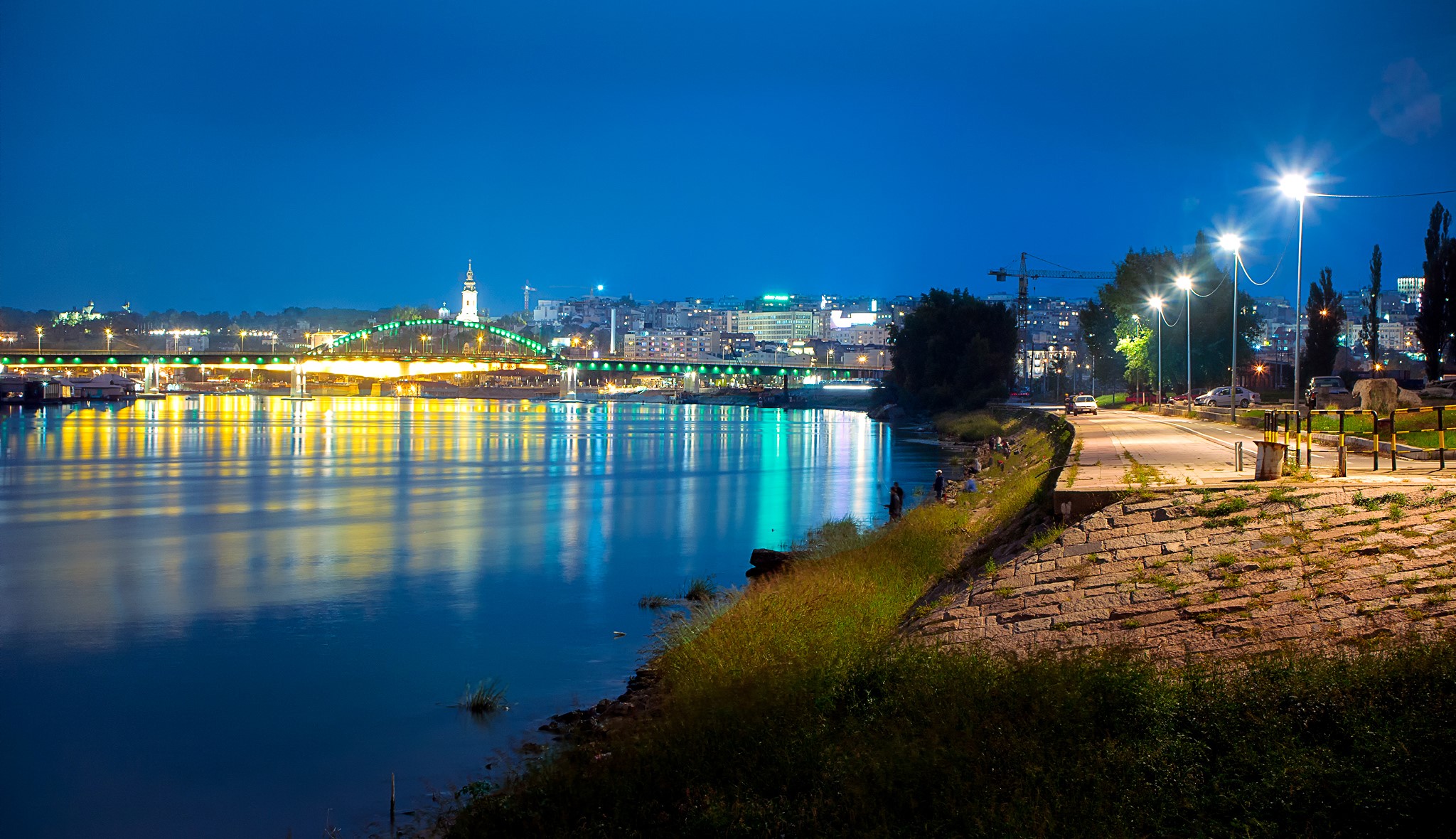 Belgrade cityscape with bridge and river at night HD Wallpaper