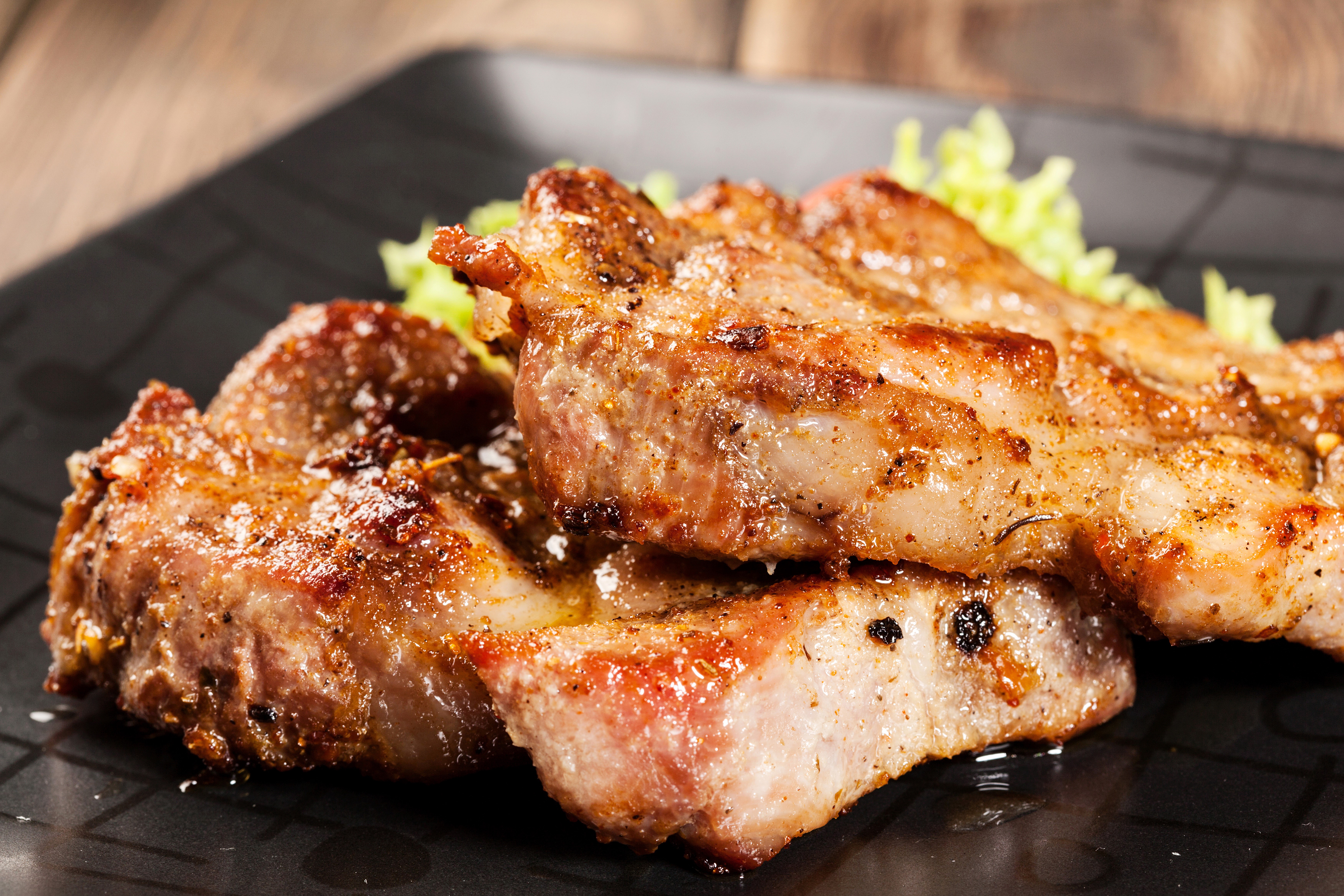 Grilled Meat Products on a Black Plate HD Wallpaper