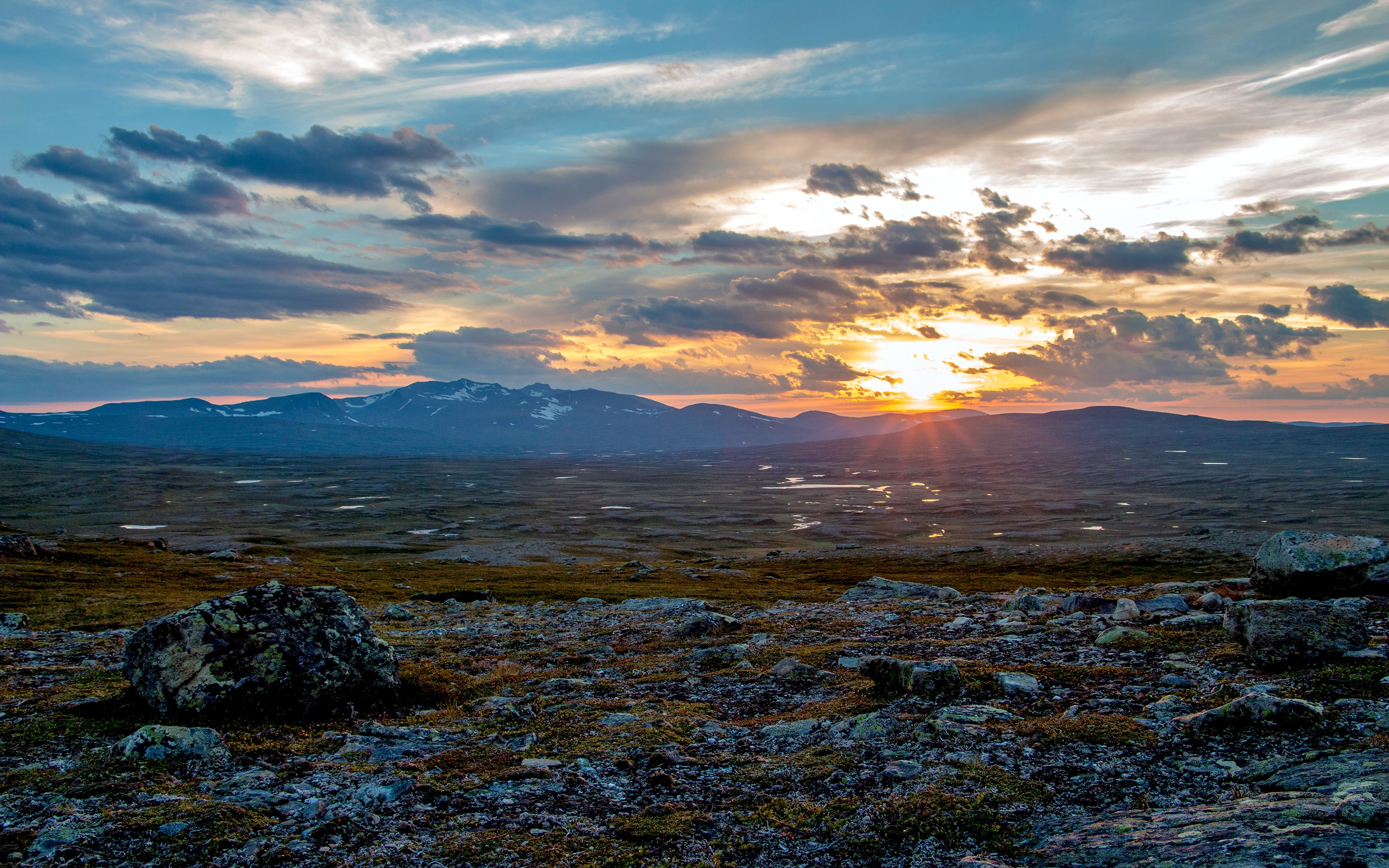 Sunset over Swedish mountains with rocky foreground HD Wallpaper