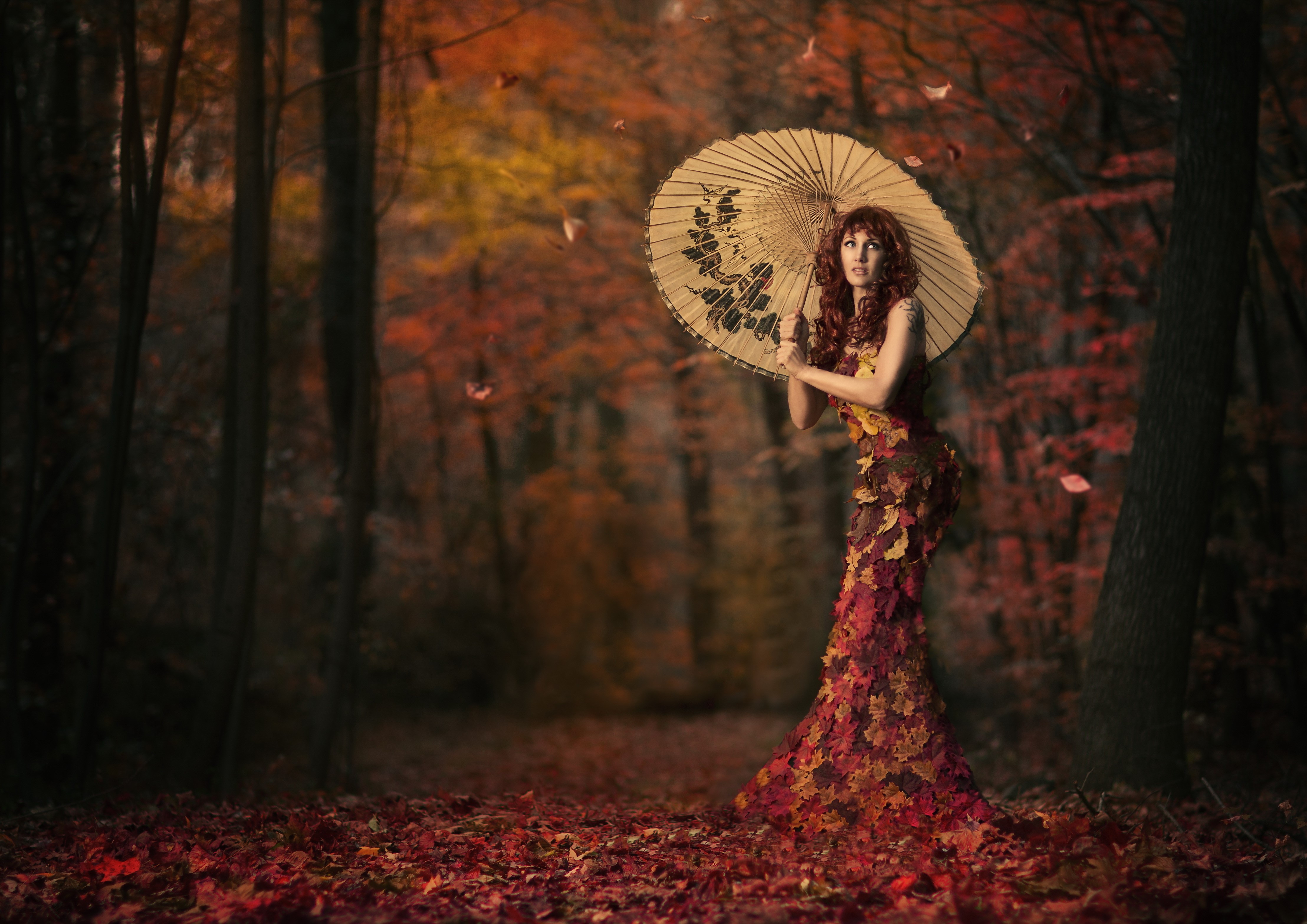 Woman in Leaf Dress with Umbrella in Autumn Forest HD Wallpaper