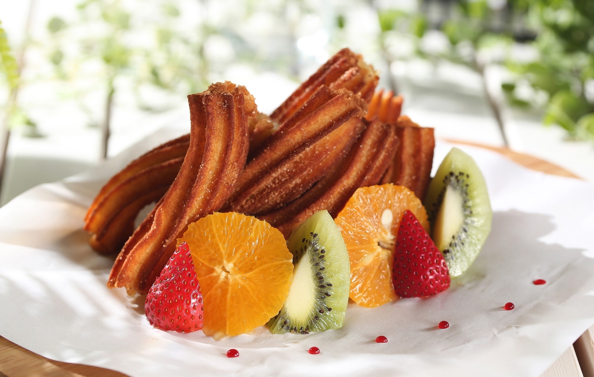 Churros with fresh fruit slices HD Wallpaper