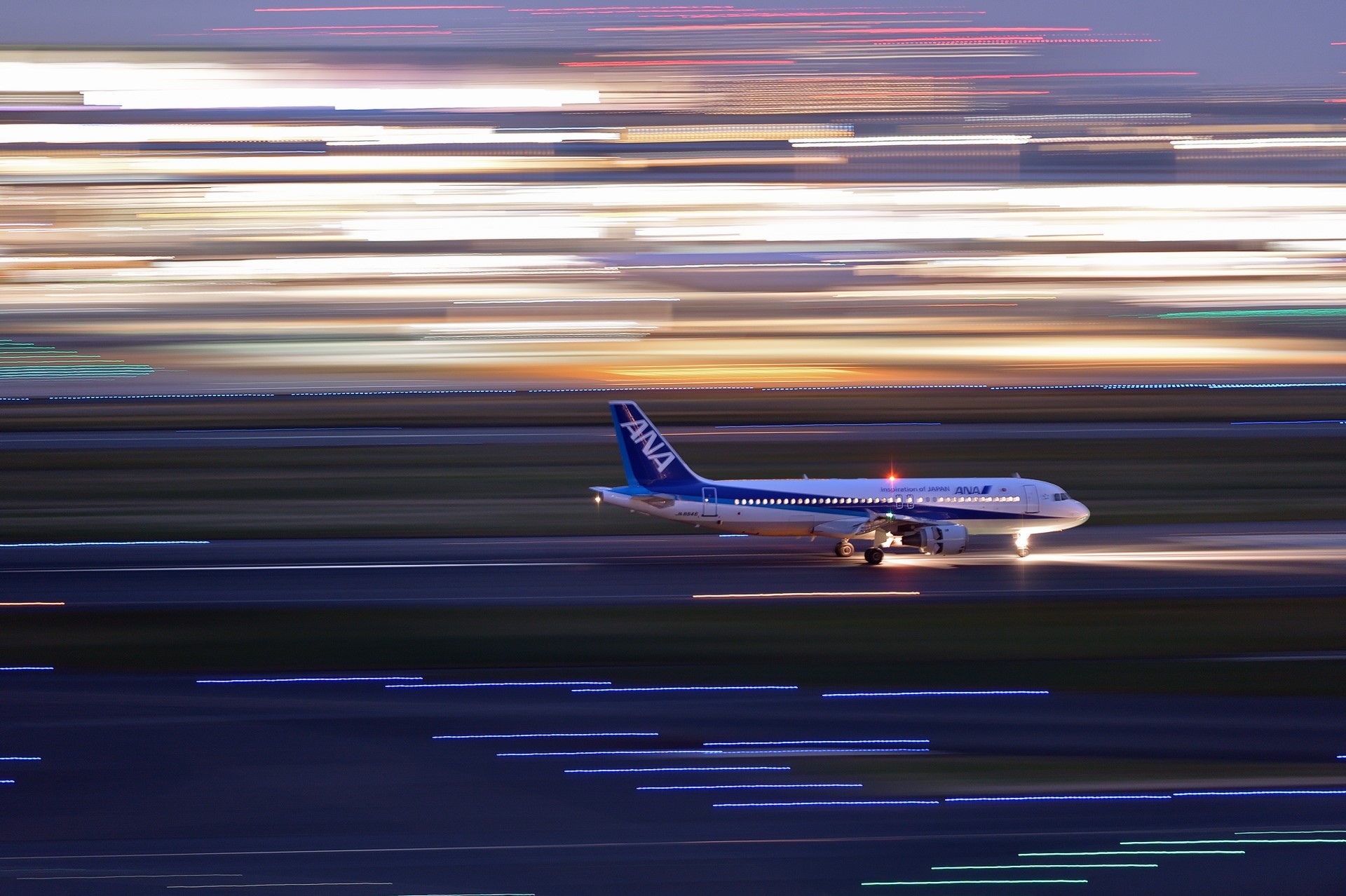ANA Airplane on Runway with Light Streaks HD Wallpaper