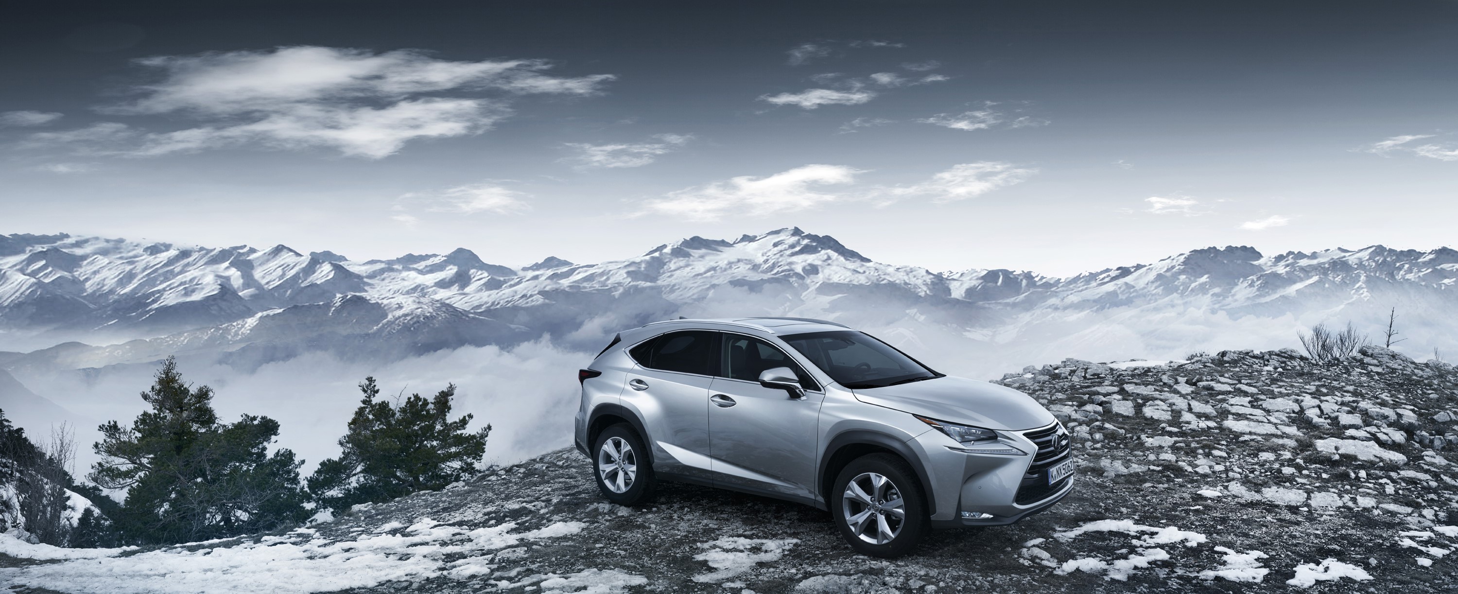 Lexus NX SUV on a rocky mountain overlook HD Wallpaper