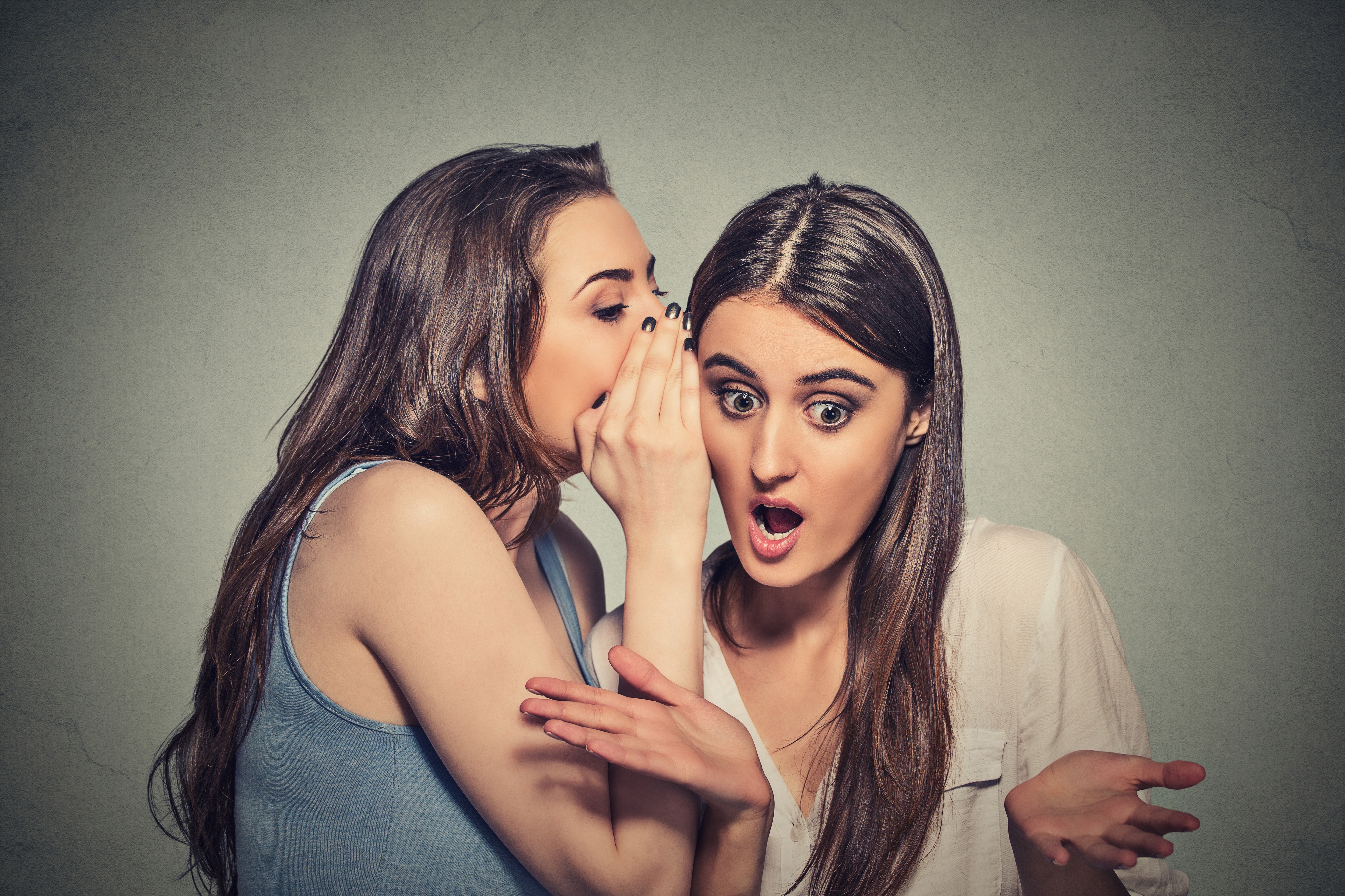 Two women sharing a secret HD Wallpaper