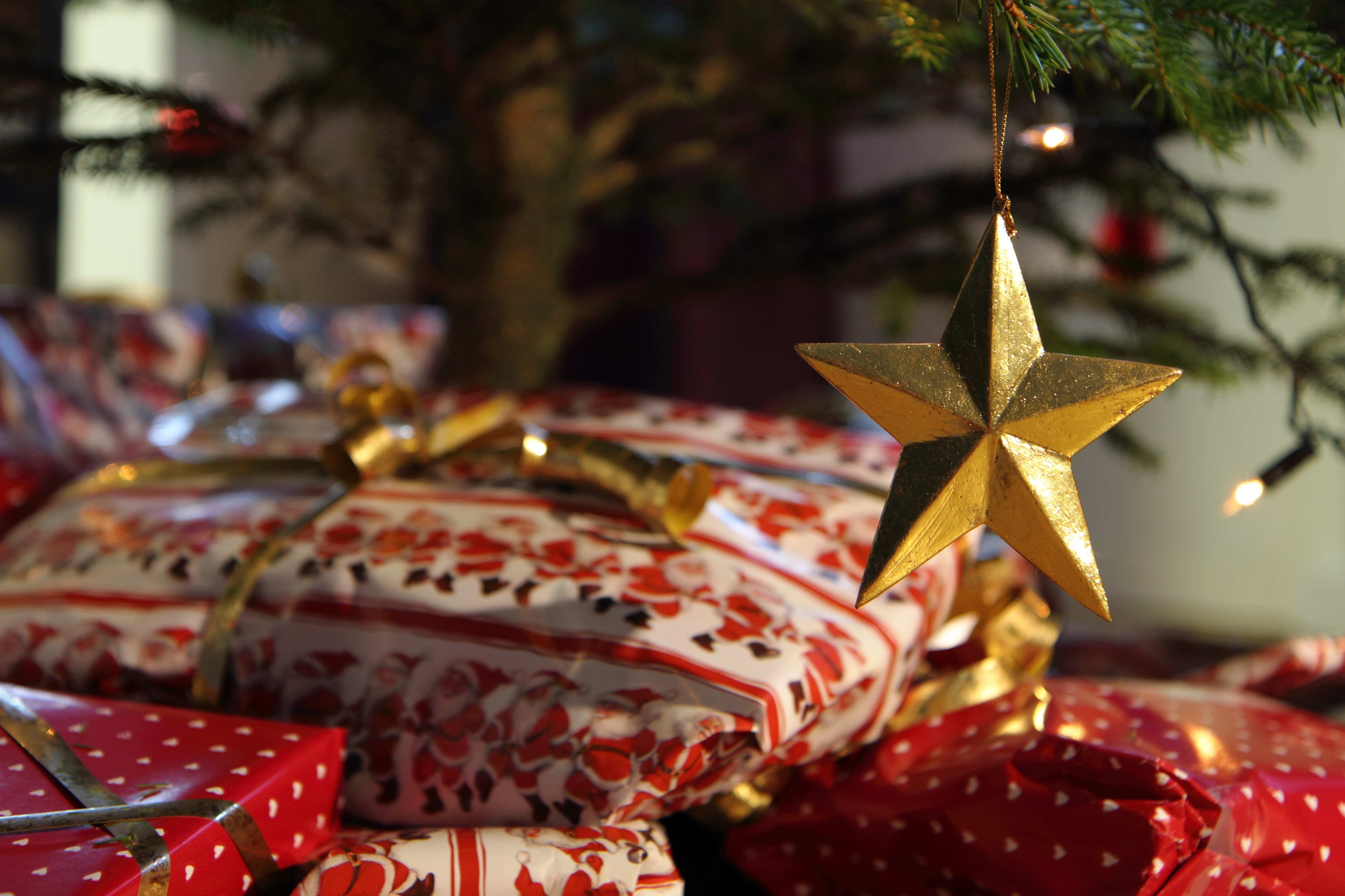 Christmas Gifts Under a Tree with Star Ornament HD Wallpaper