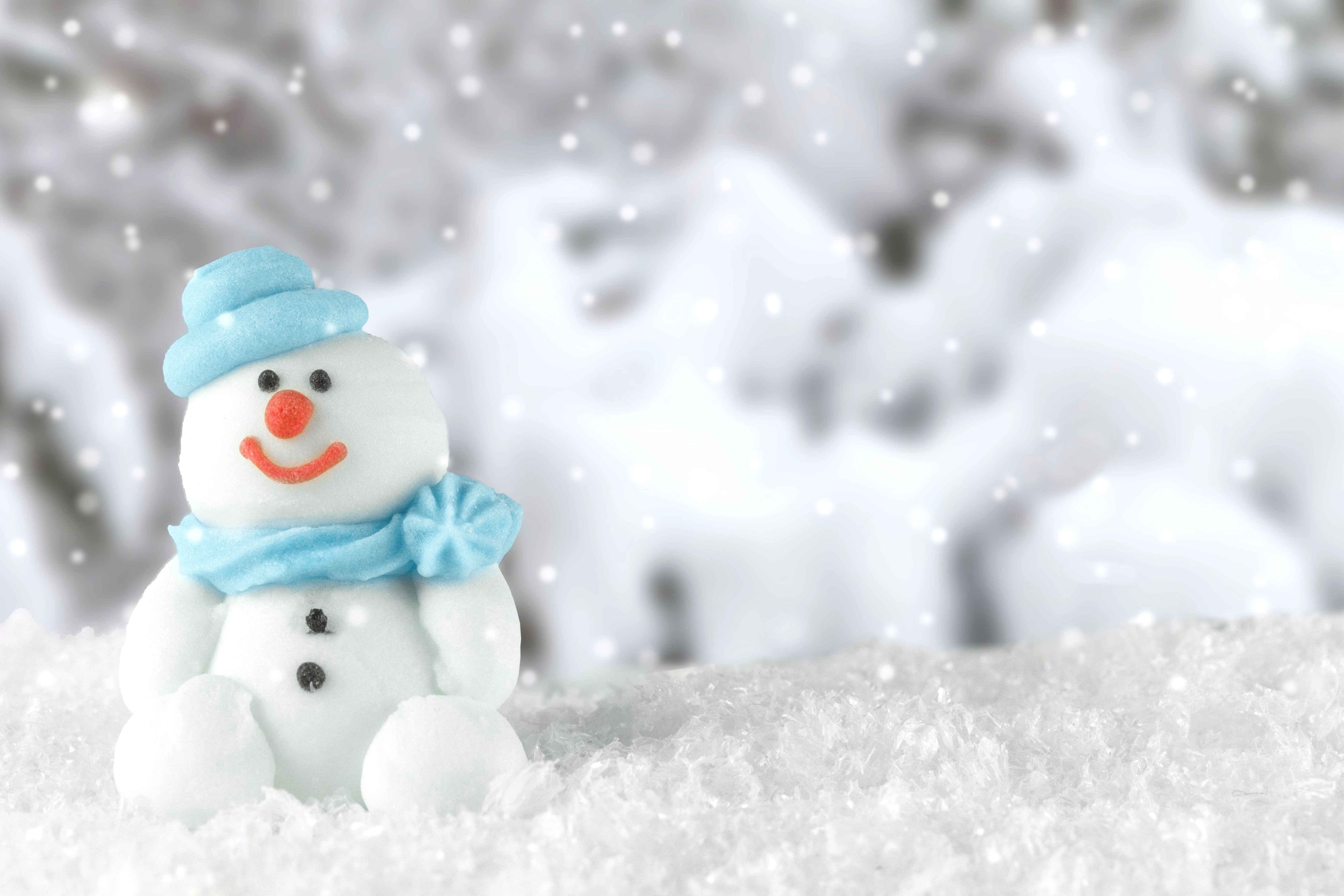 Snowman with blue hat and scarf in snow HD Wallpaper