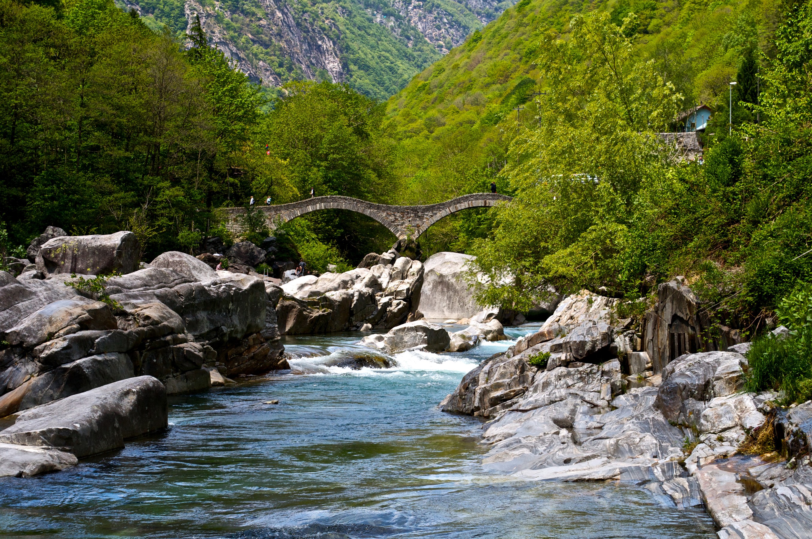 Stone bridge over a river in Verzasca Valley, Switzerland HD Wallpaper