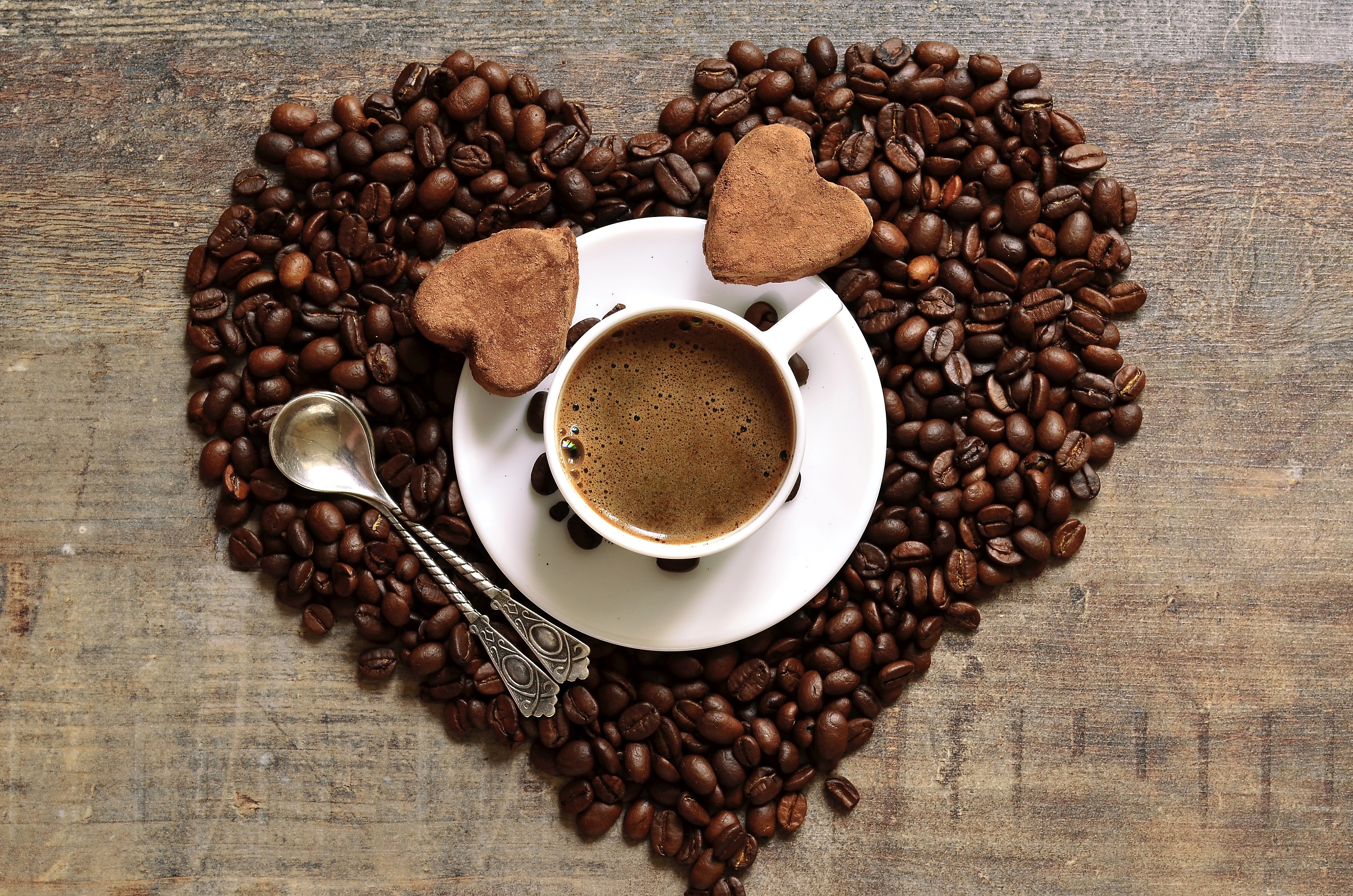 Heart shape made of coffee beans with a cup and cookies HD Wallpaper