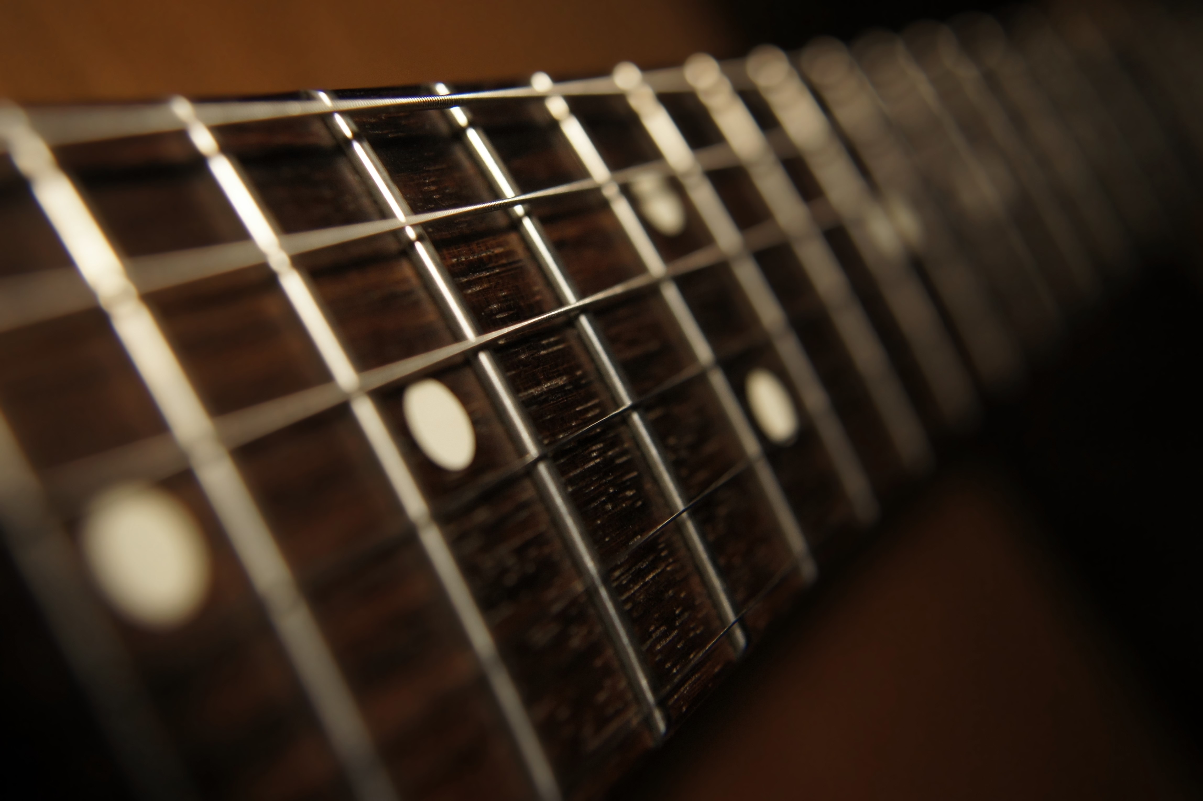 Closeup of a Guitar Fretboard HD Wallpaper