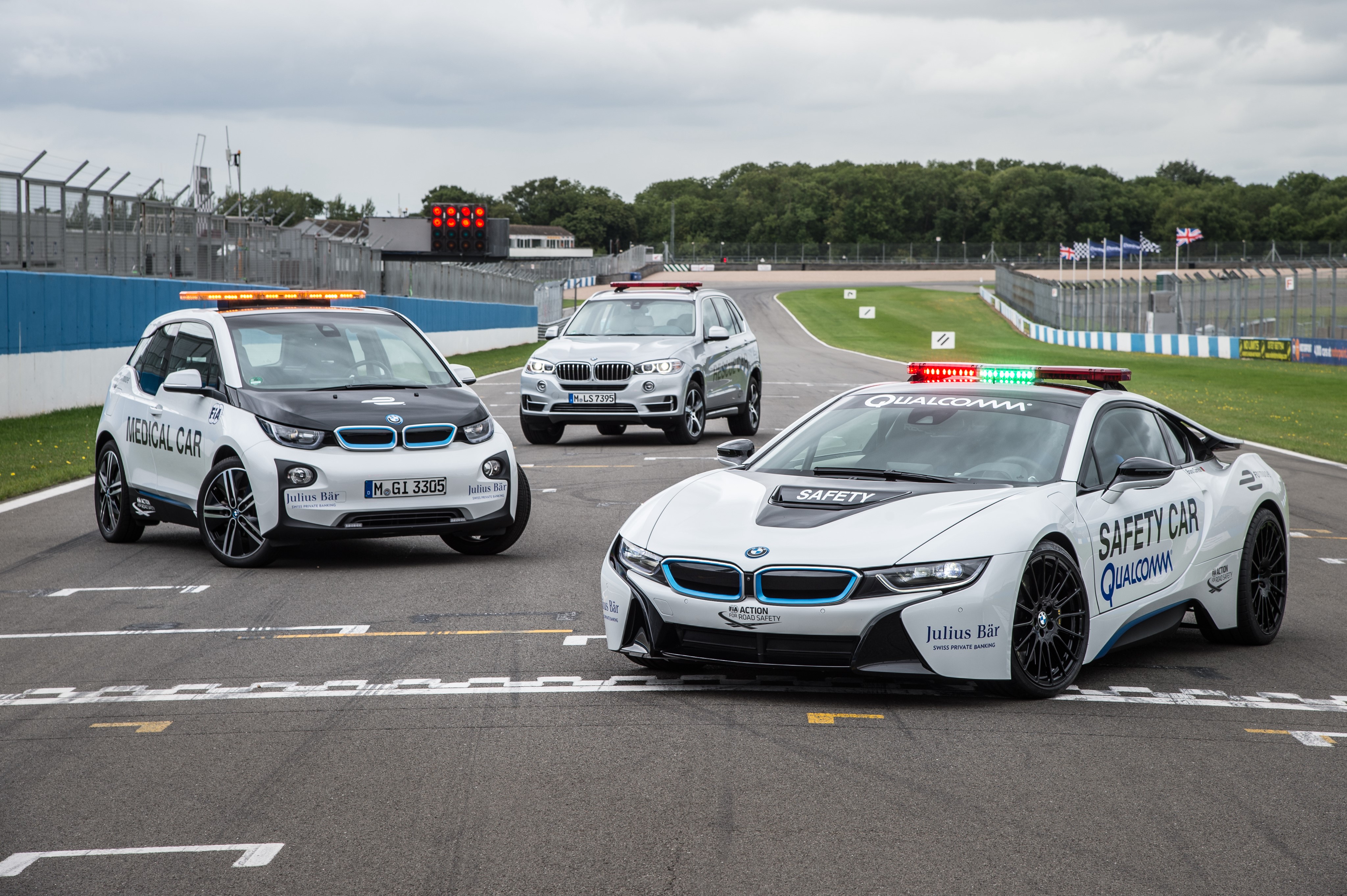 Three BMW Safety and Medical Cars on Racetrack HD Wallpaper