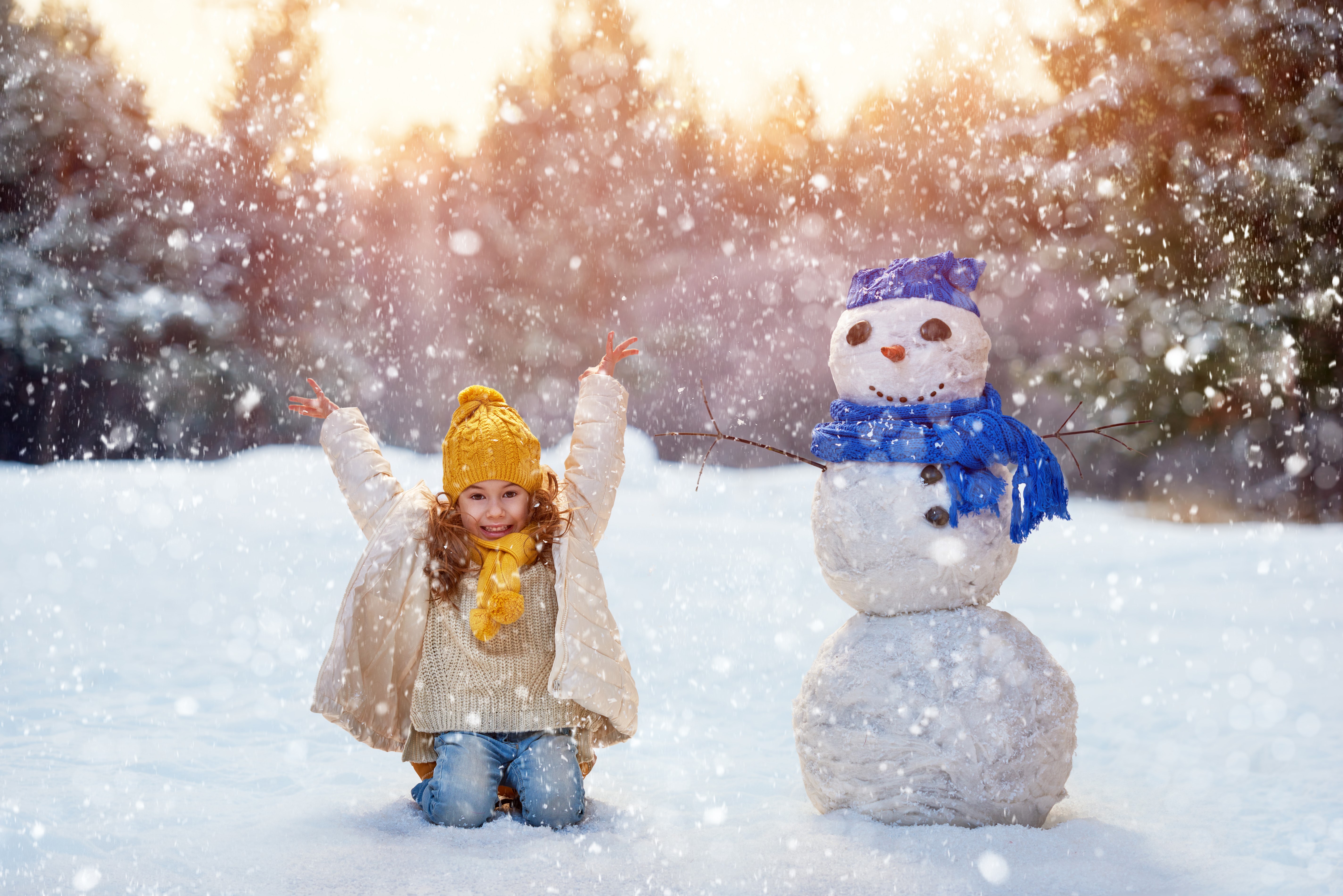 Girl and Snowman in Falling Snow HD Wallpaper