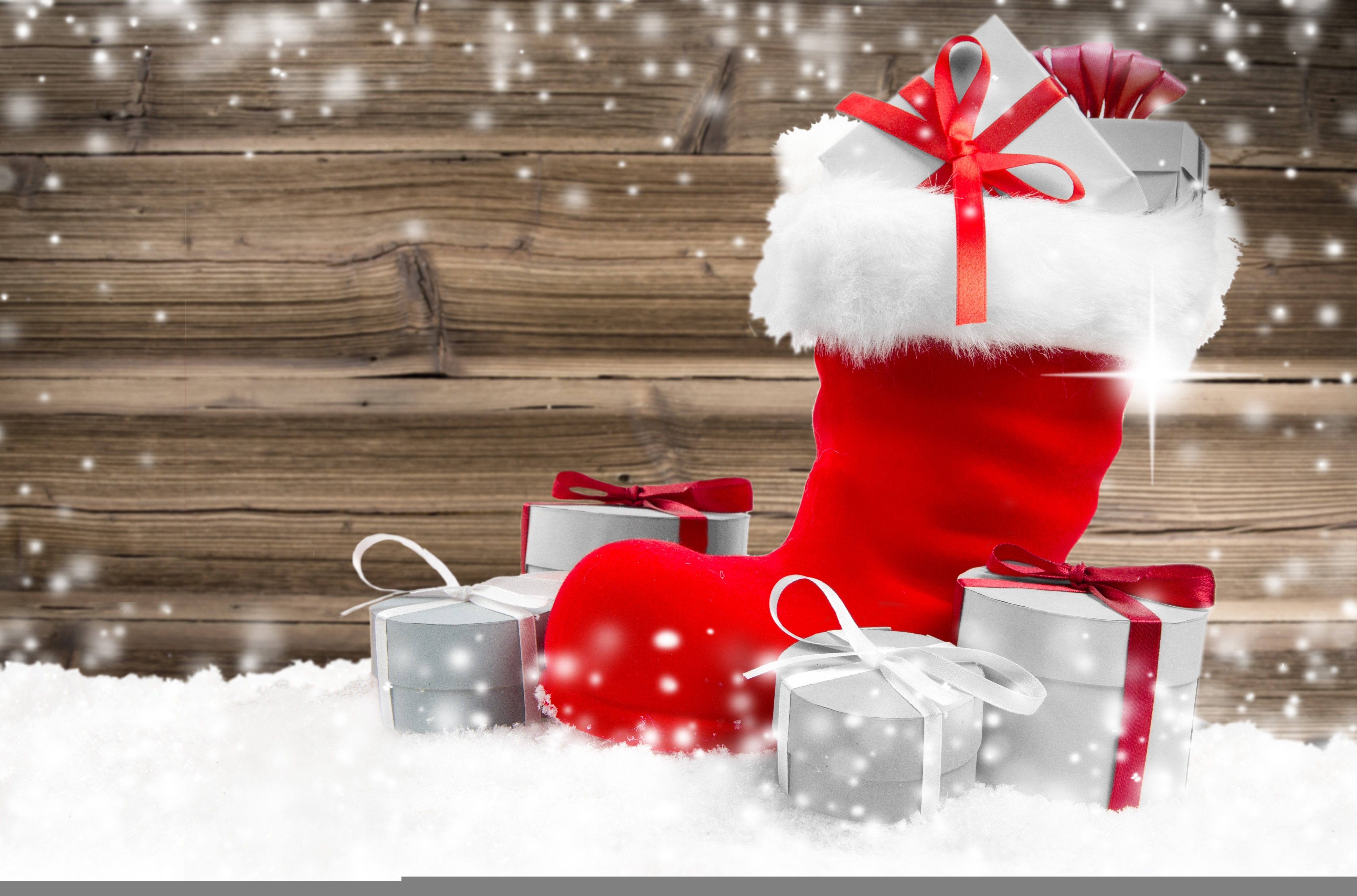 Christmas stocking with gifts in snow HD Wallpaper